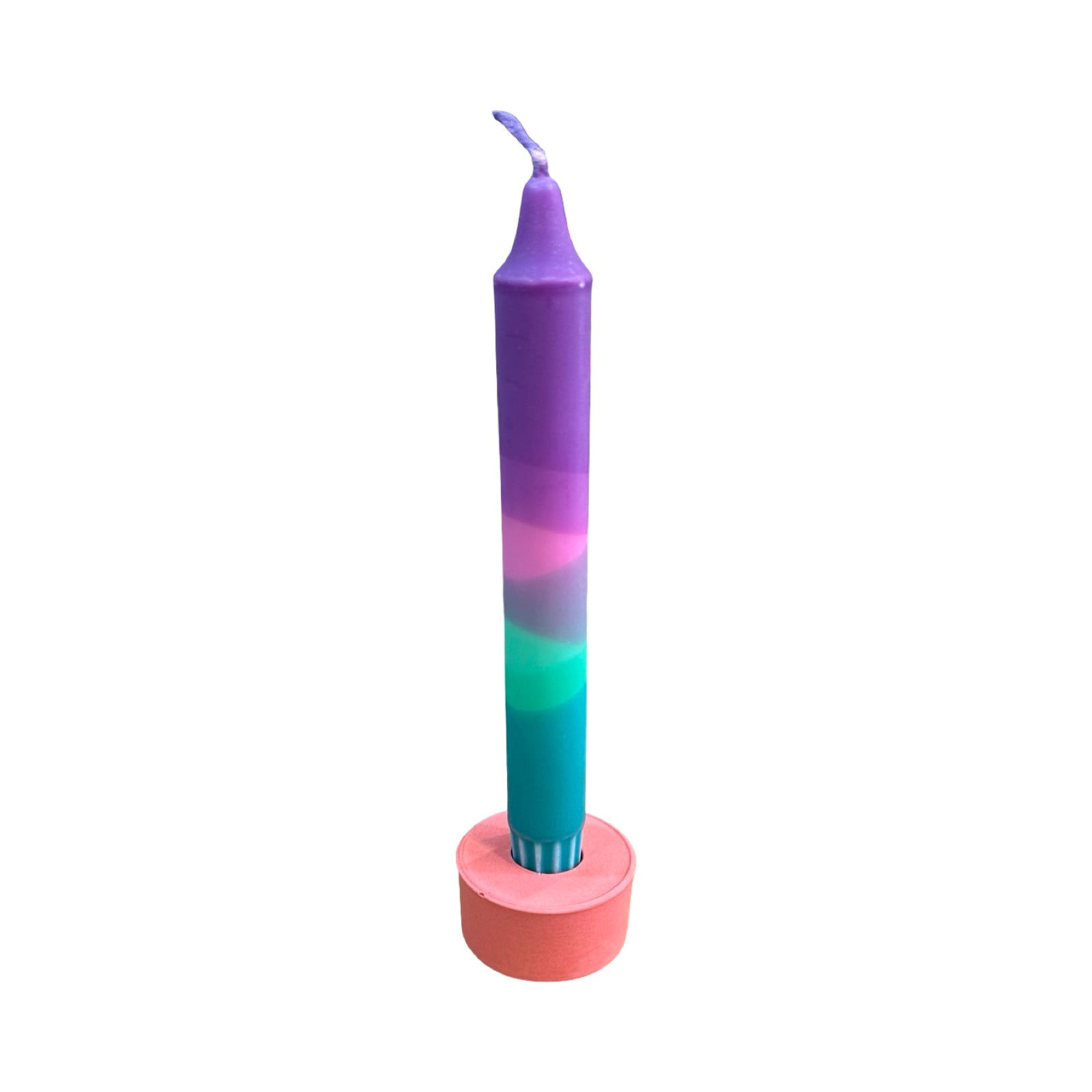 A small circular dinner candle holder in pink holding a purple, pink and green blended dinner candle.
