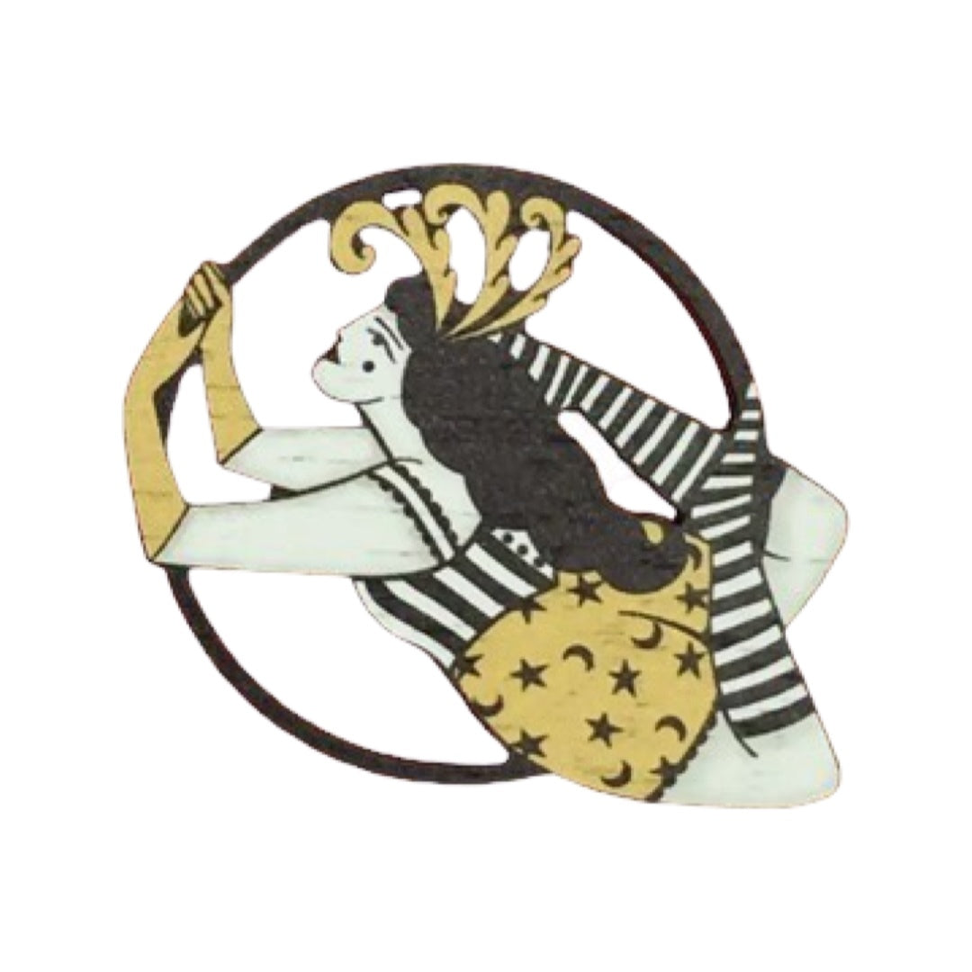 Circus aerialist wooden brooch featuring a female performer in a yellow and black costume with a feather headdress.