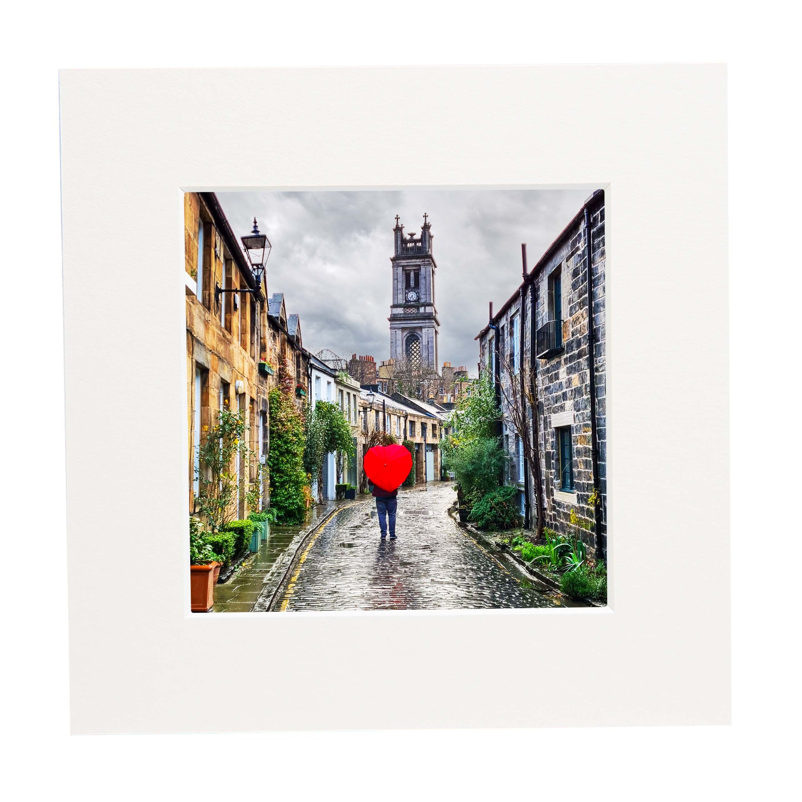 An image of Circus Lane and a person walking with a love heart shaped umbrella. 