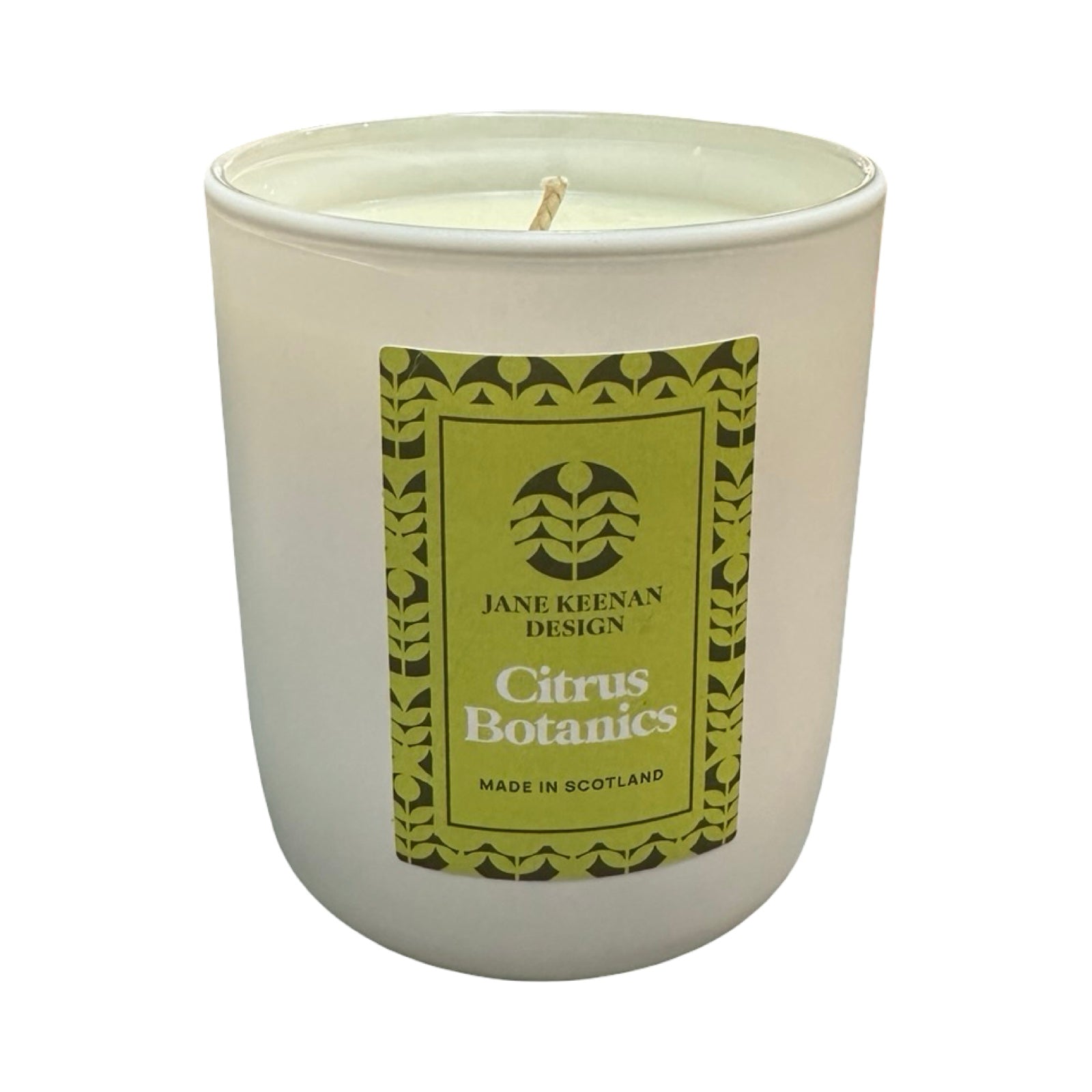 Candle with a green label on a white background.