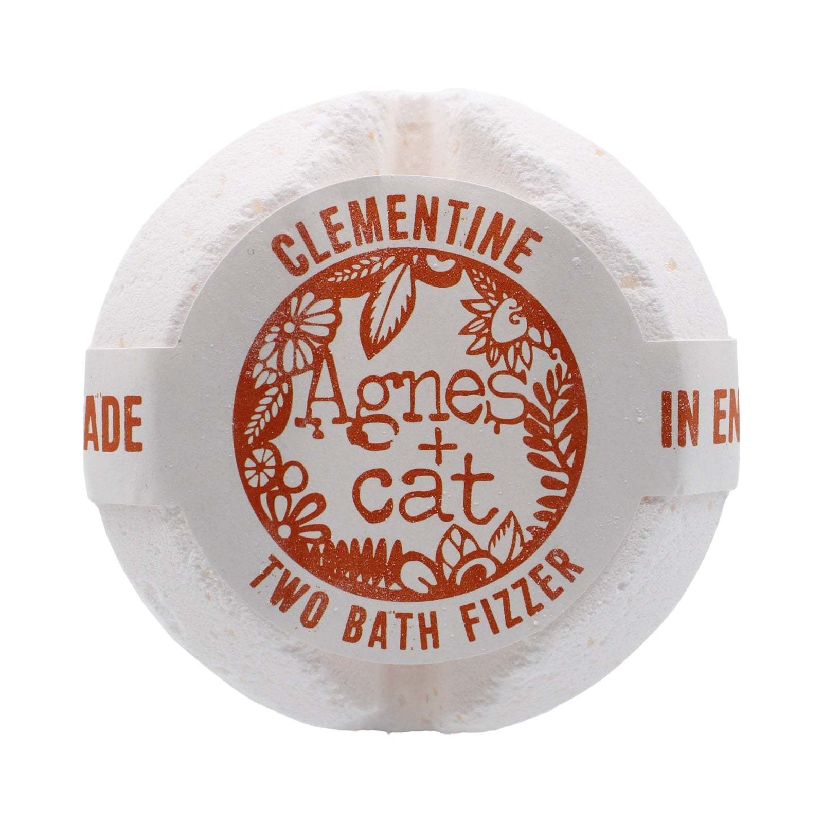 A circular shaped white clementine scented bath fizzer