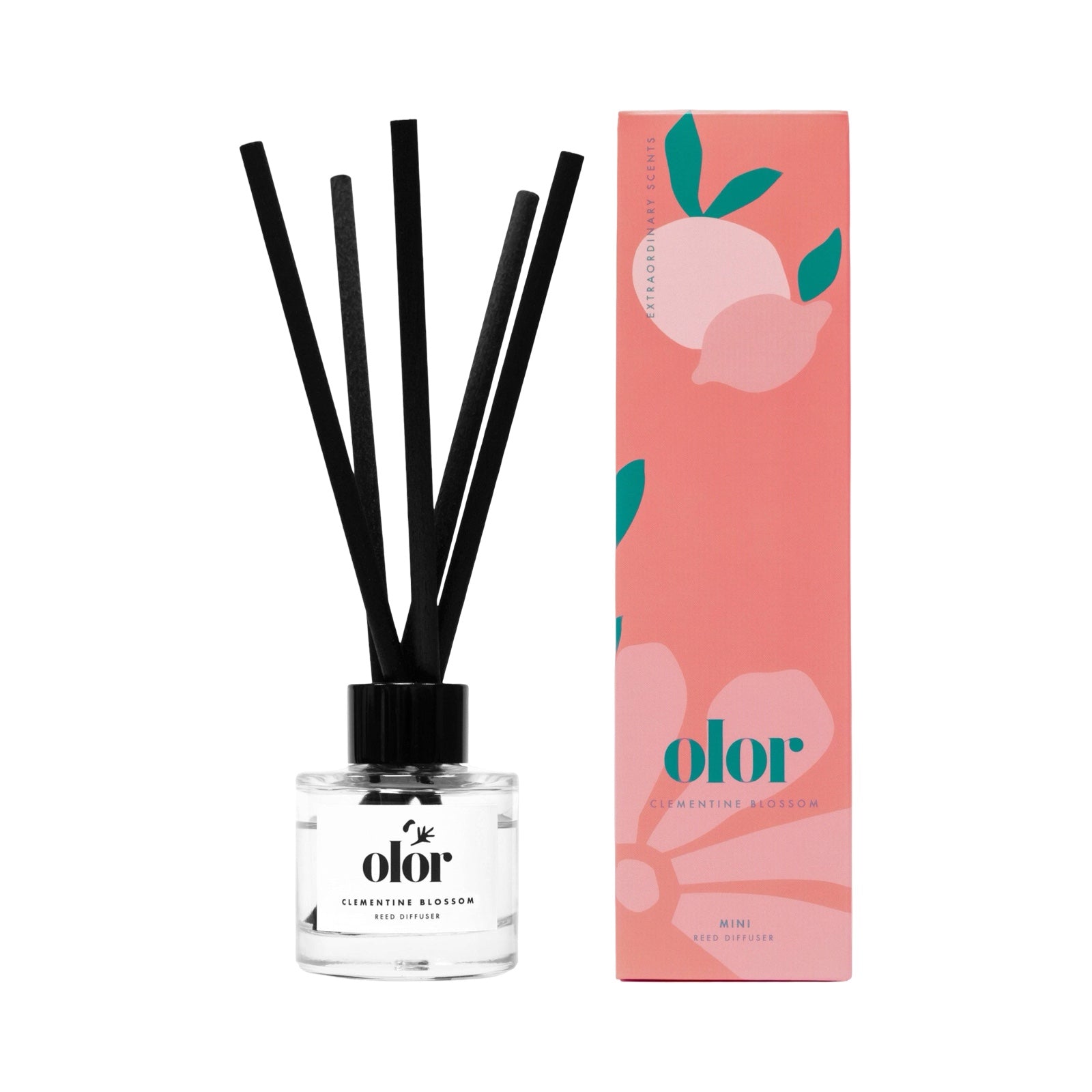 Clementine blossom reed diffuser next to pink box.