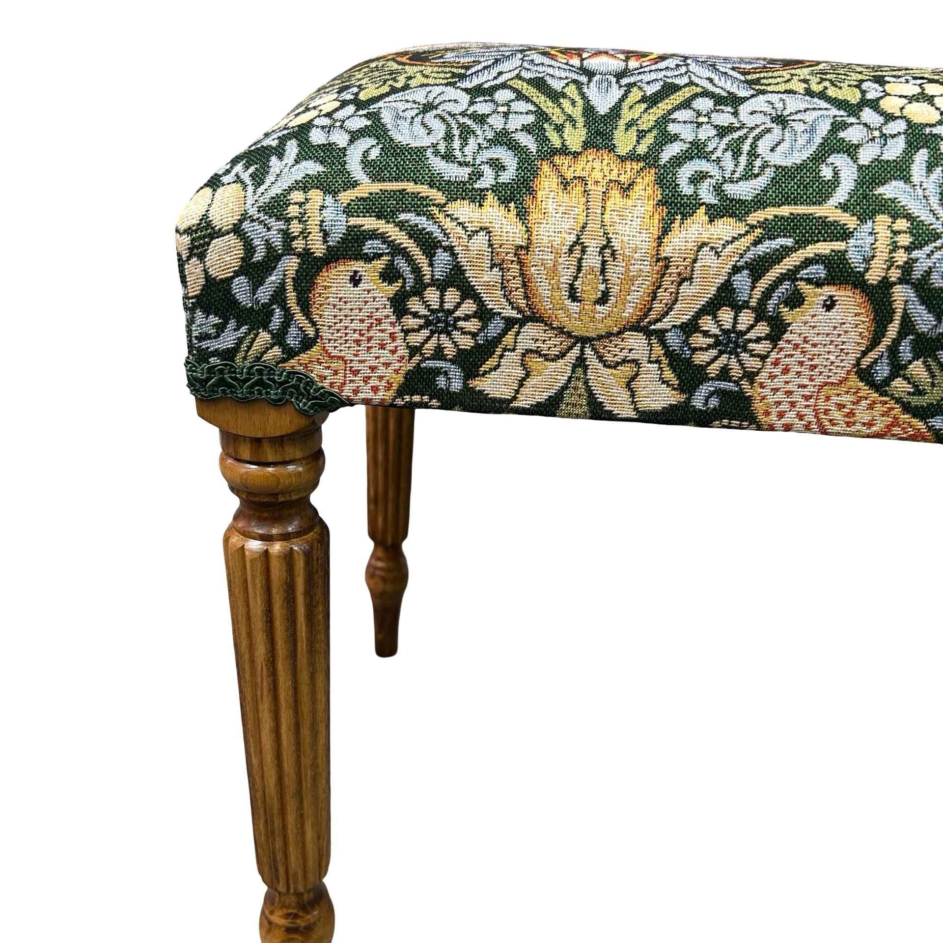 Close up of occasional bench with mahogany legs and a green Strawberry Thief cotton embroidery style fabric cover.