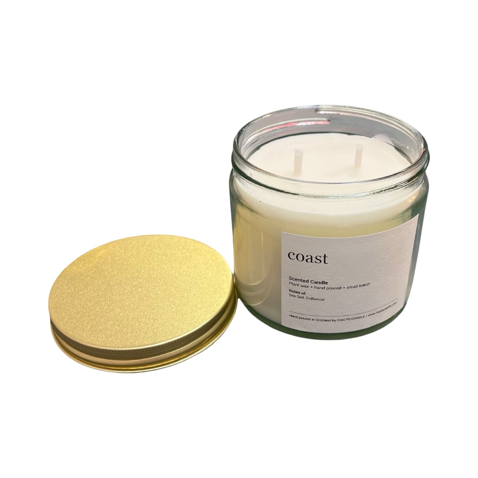 Glass candle with a gold lid on a white background.