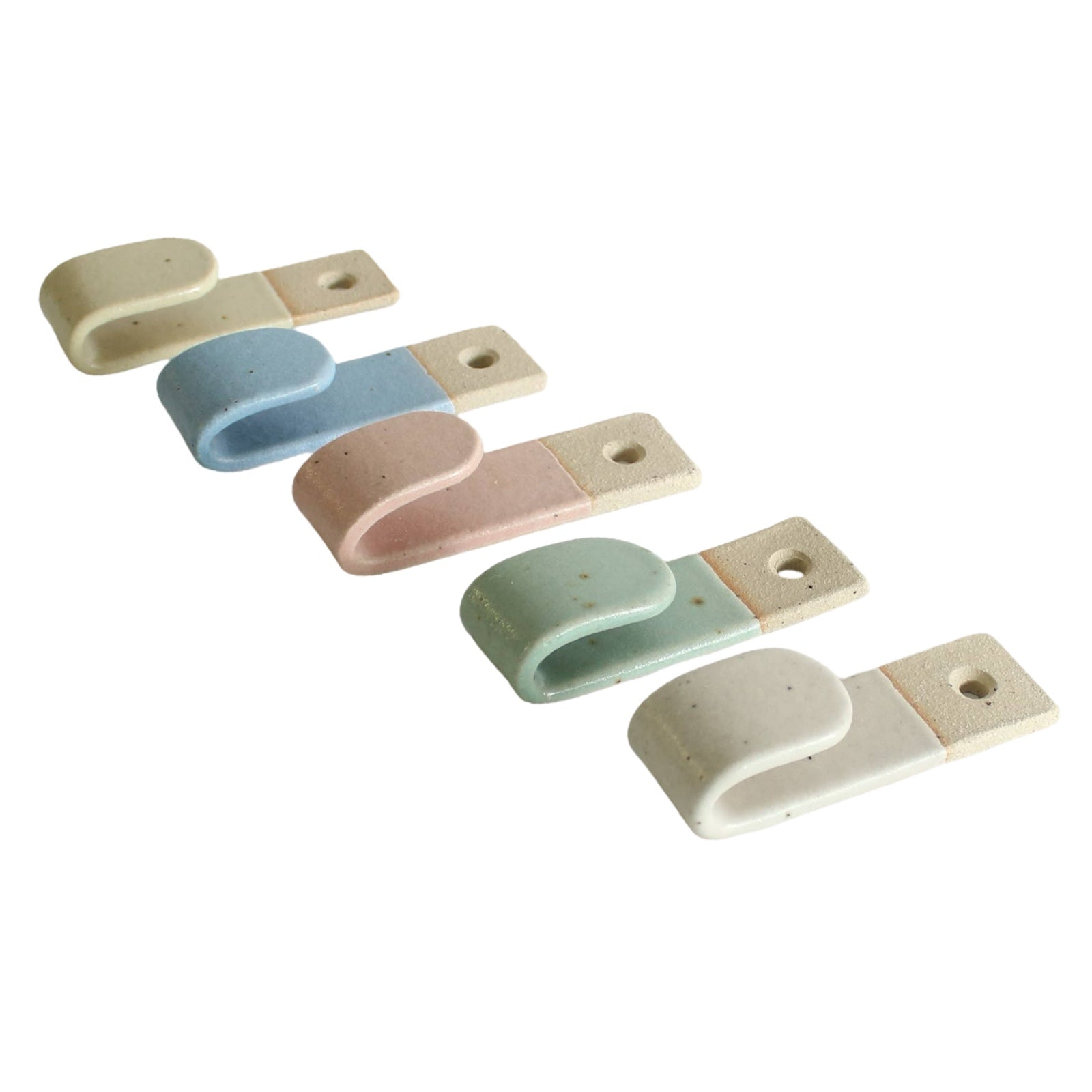 A row of 5 pastel coloured stoneware wall hooks