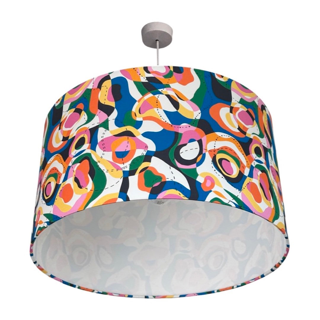 drum lampshade covered in Liberty cotton fabric in a multicoloured map contour design with a retro twist