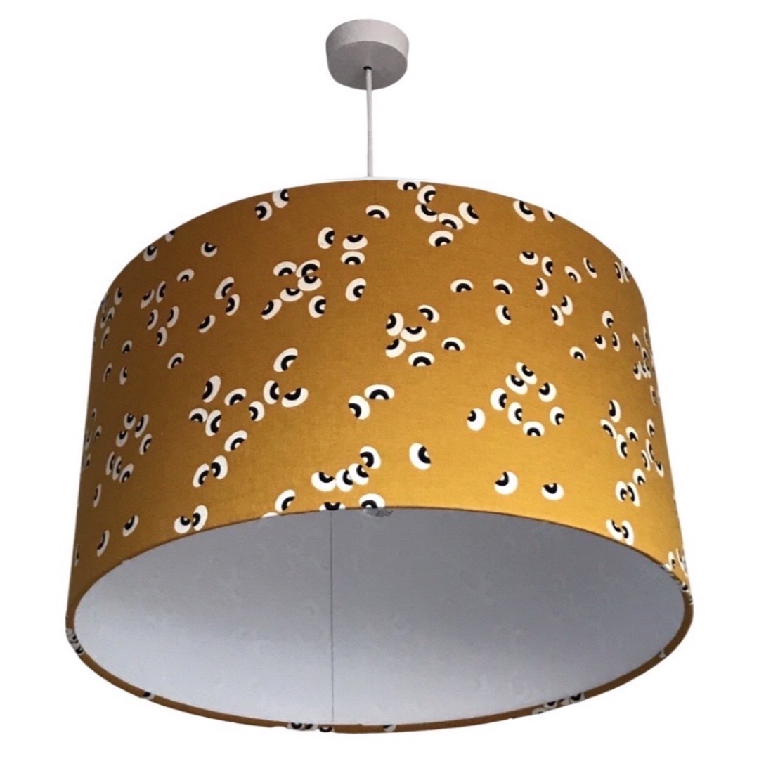 Drum lampshade in mustard with a black and white beans pattern