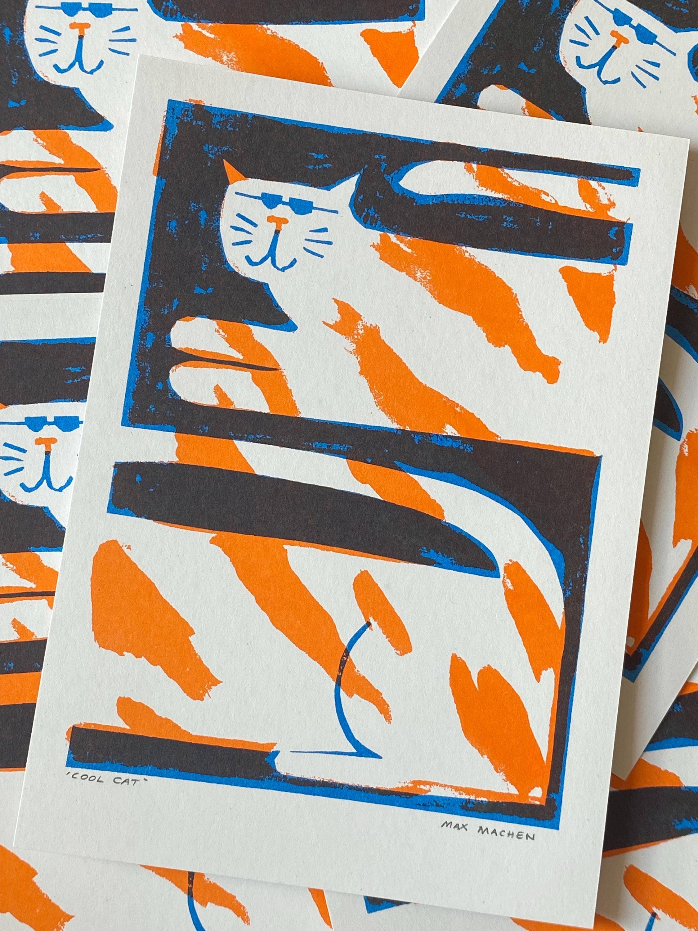 Two-colour risograph print featuring a ginger and white cat, against a black background.