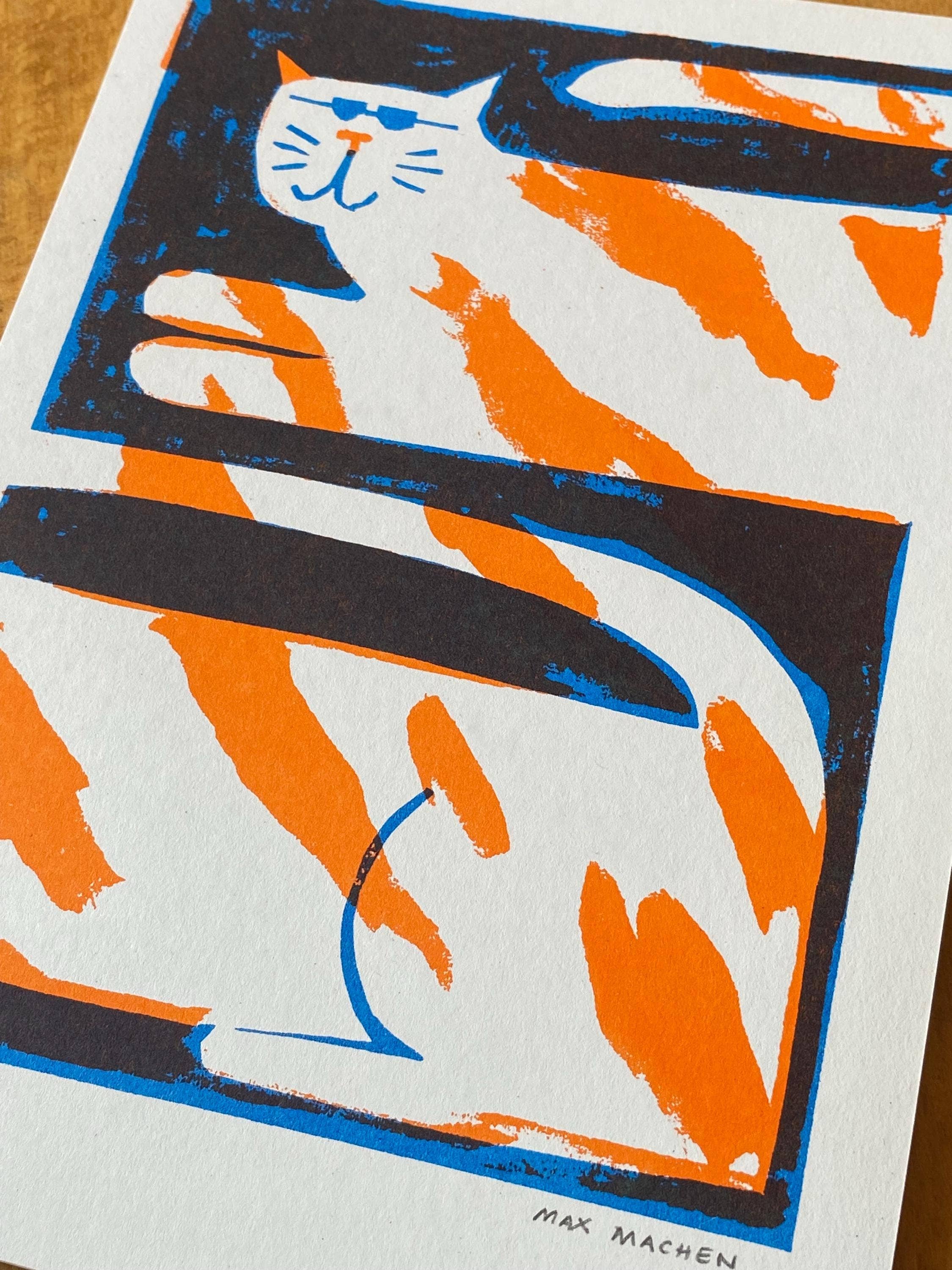 Two-colour risograph print featuring a ginger and white cat, against a black background.