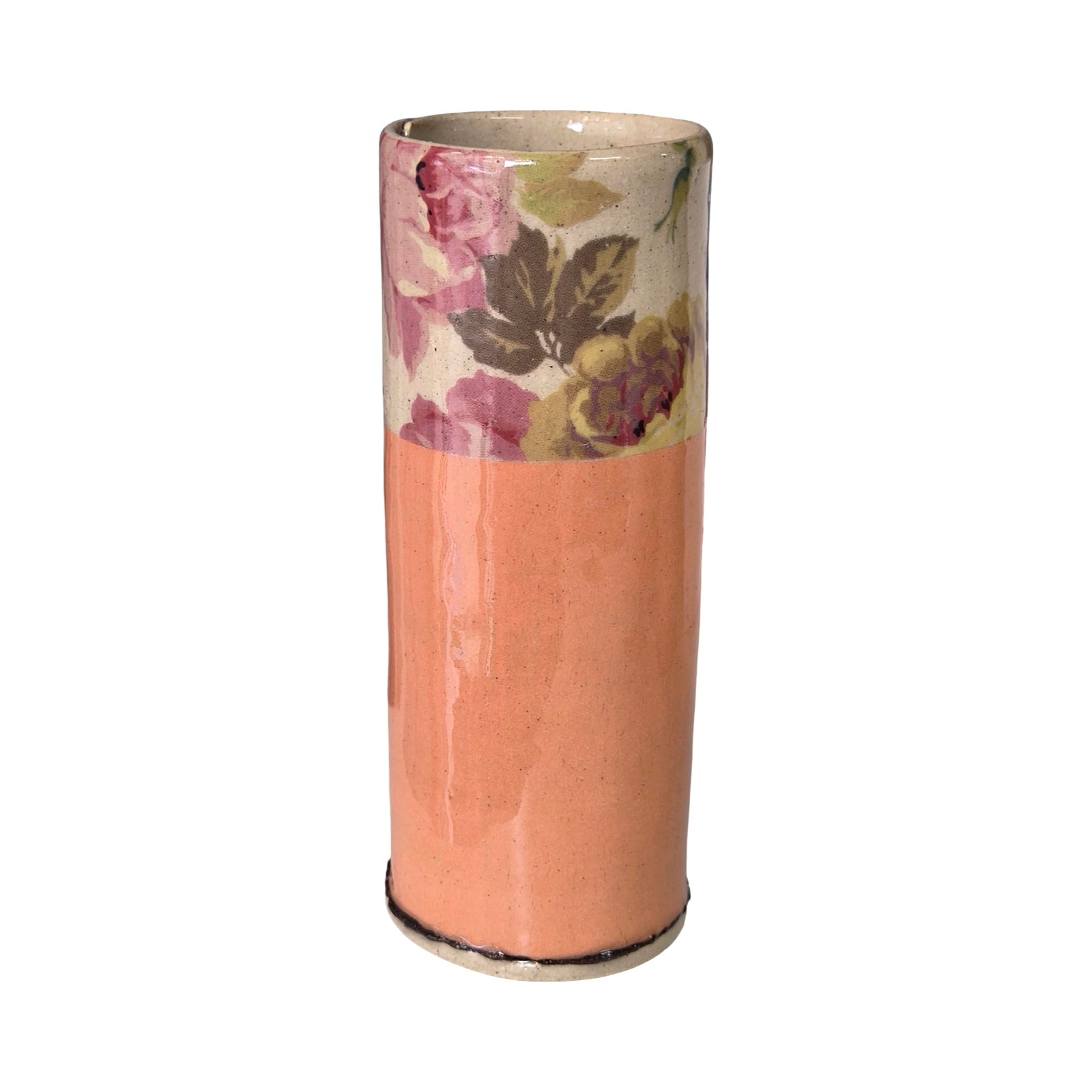 Cylindrical vase with floral design on a white background.
