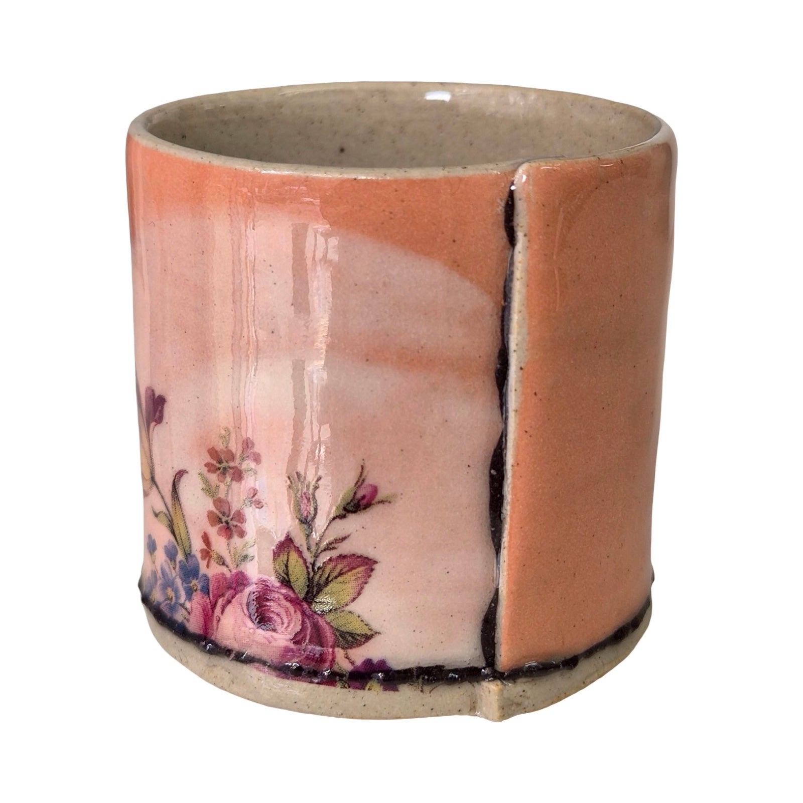 Ceramic planter with floral design on a white background.