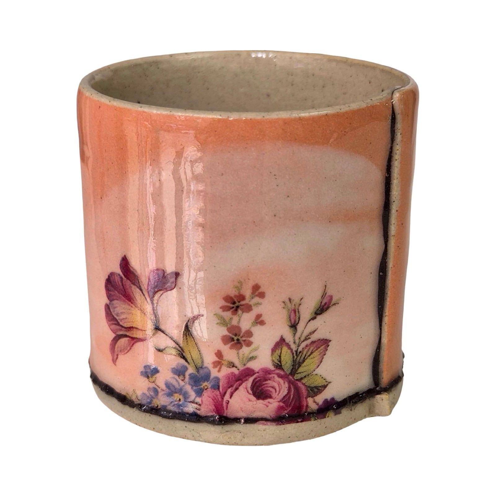 Ceramic planter with floral design on a white background.