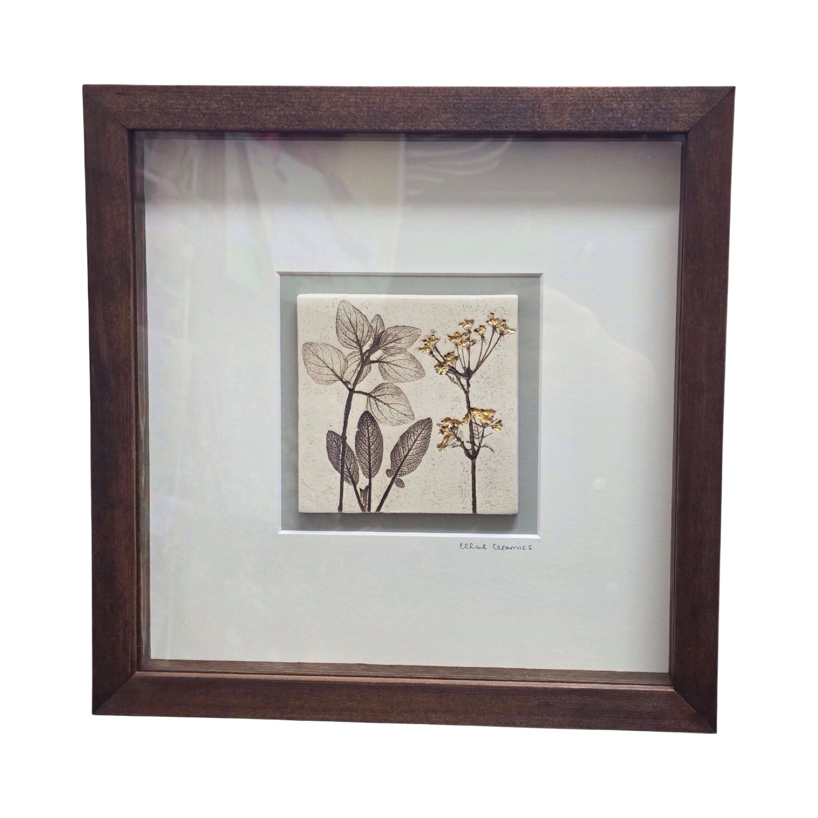 Framed tile featuring cow parsley in a wench frame on a white background