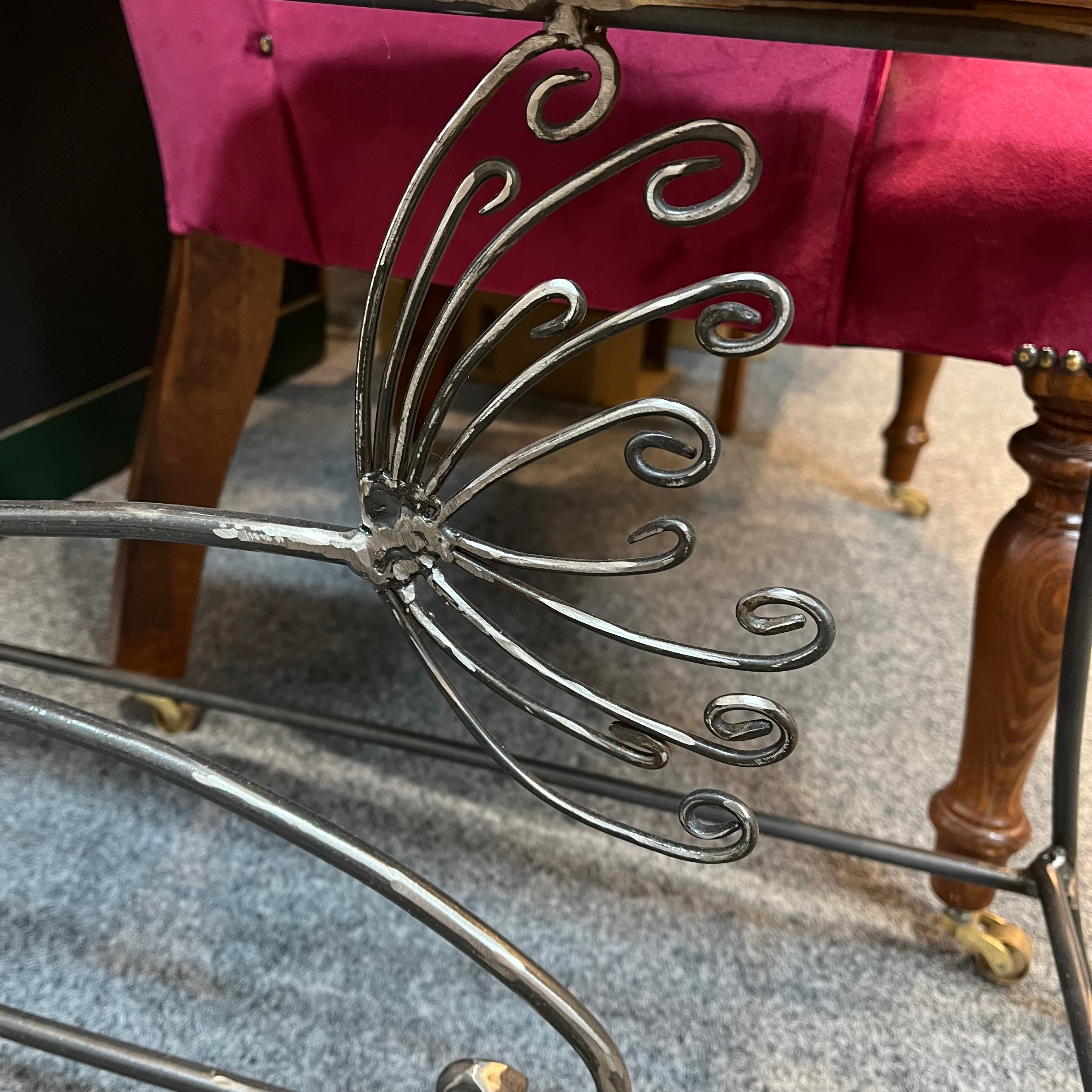 A handmade table/bench with an yew wooden top and a galvanised steel frame with a cow parsley design. Suitable for indoor or outdoor use. (Galvanised steel will dull as it weathers, but it won't rust).