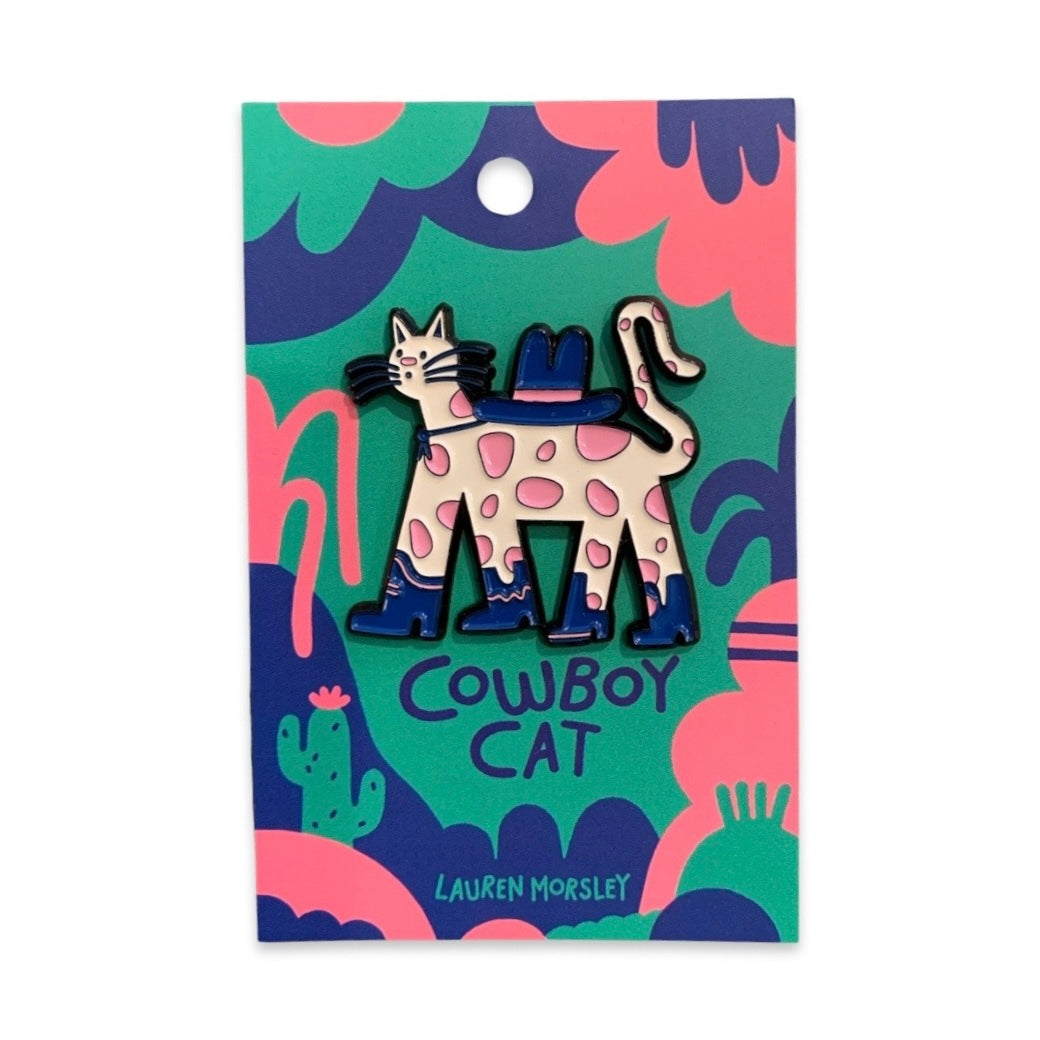 A cowboy cat themed enamel pin badge. 
