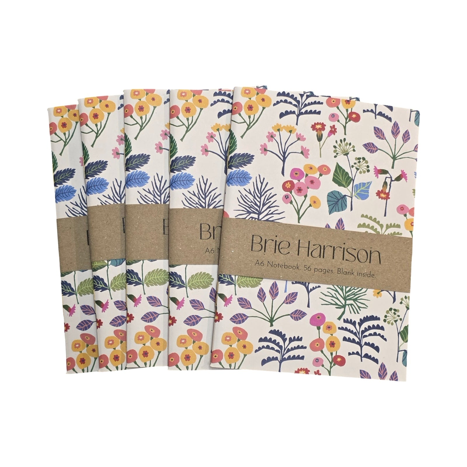 Set of four notebooks with floral patterns and a visible brand label on a white background.