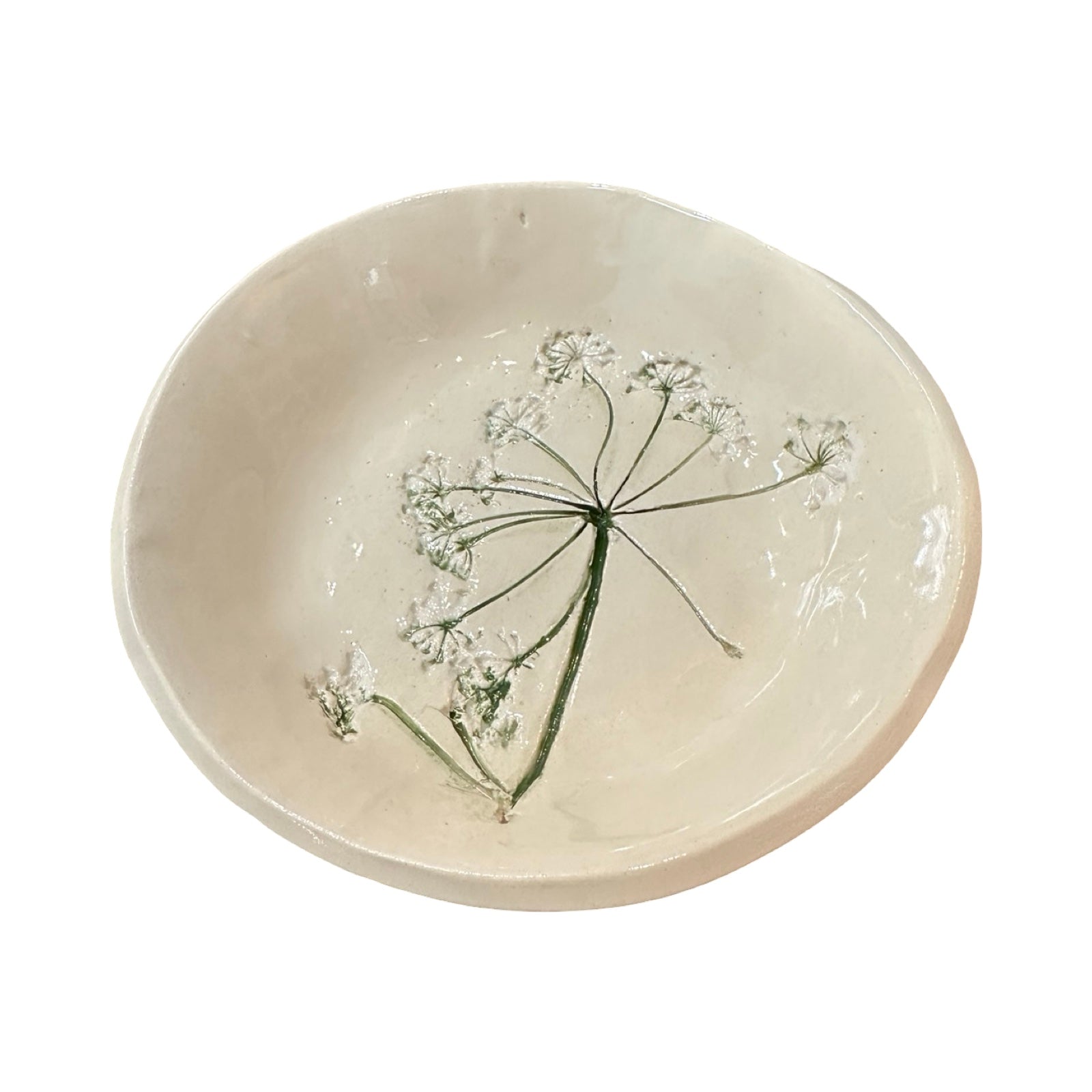 Ceramic dish with floral design on a white background.