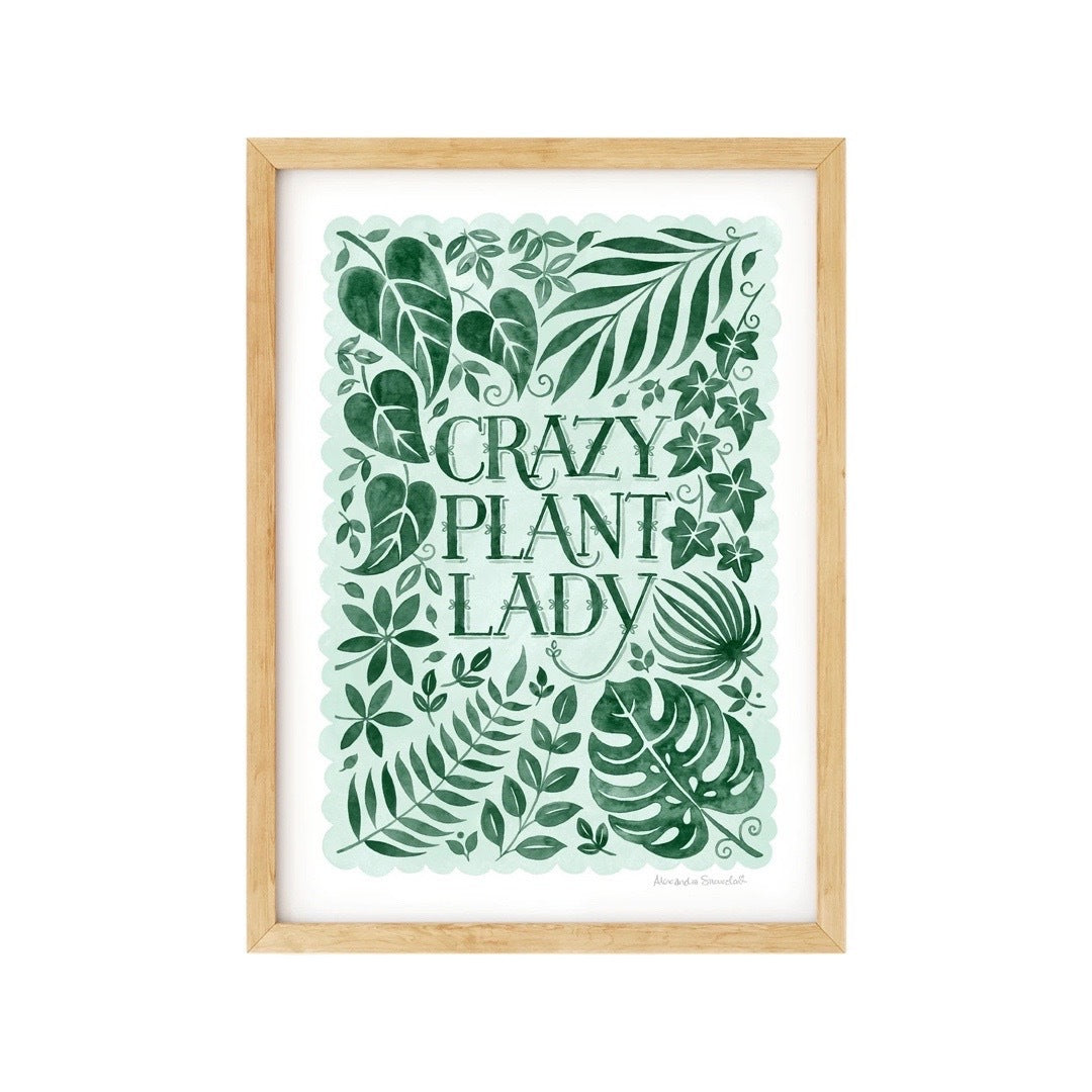 A print with lots of green foliage and the text 'crazy plant lady' in the centre, all on a paler green background with a white border.