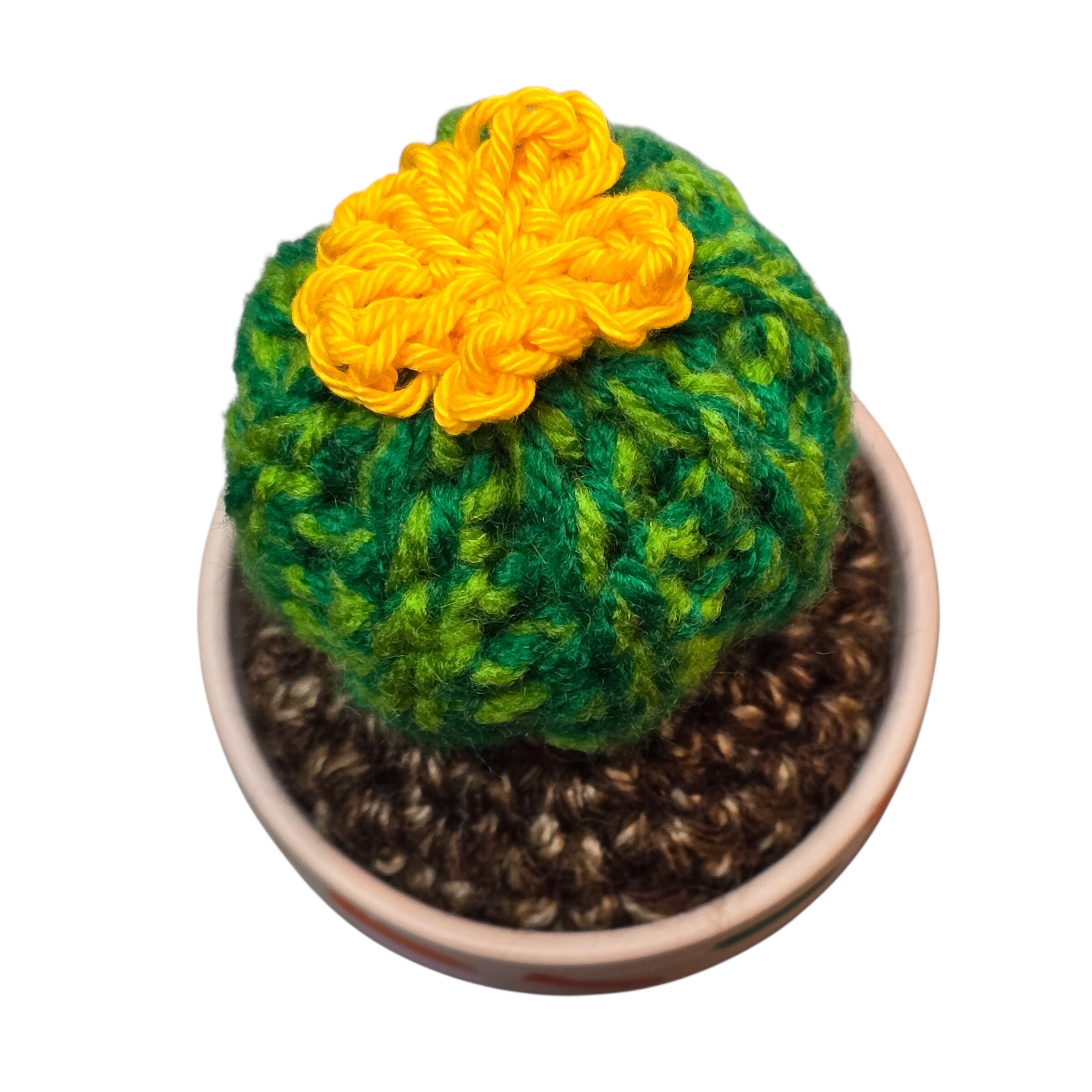 An image of a crochet cactus in a colourful handprinted pot. 
