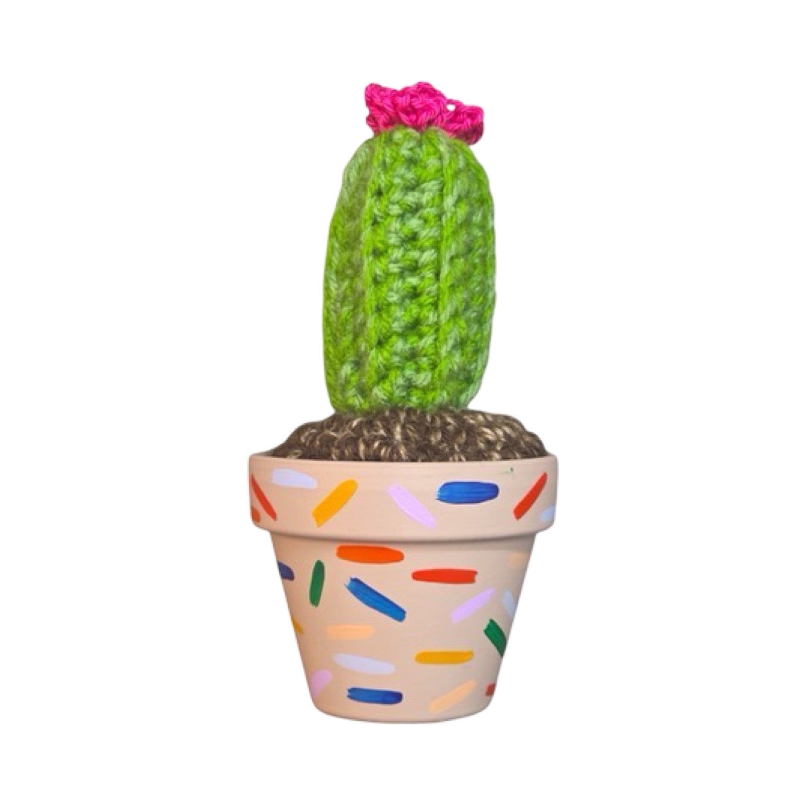 Small tall crochet cactus with pink flower in a mushroom coloured pot and confetti design.