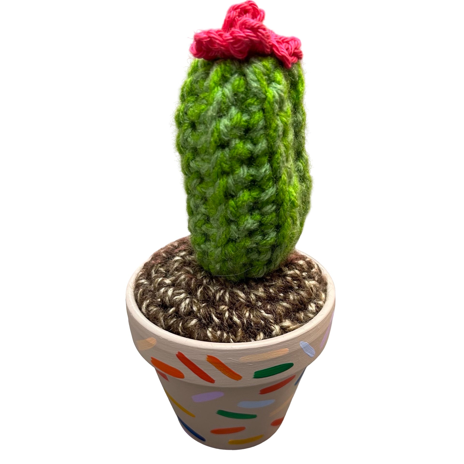 Small tall crochet cactus with pink flower in a mushroom coloured pot and confetti design.