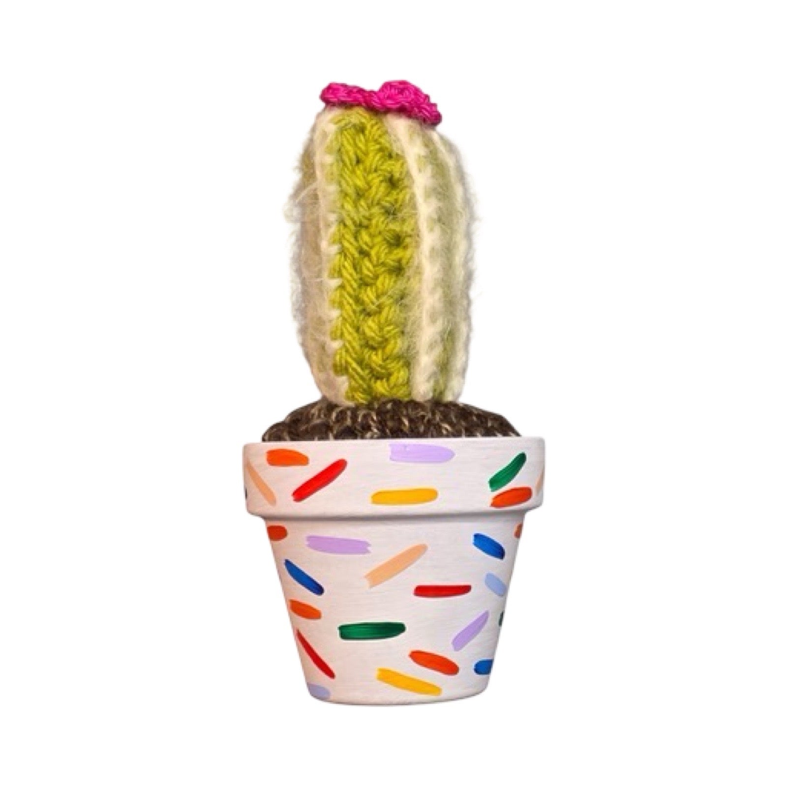 Handmade tall crochet striped cactus with a pink flower in a confetti painted white terracotta pot.