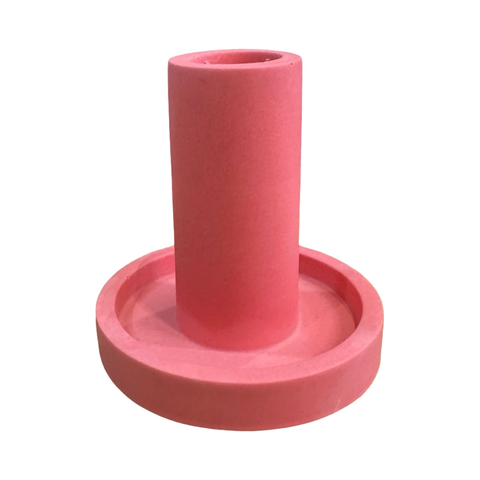 The side of a pink cylindrical dinner candle holder with a lip around the bottom to catch any drips.
