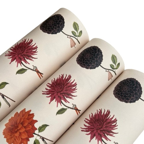 Roll of wrapping paper with floral design on a white background.