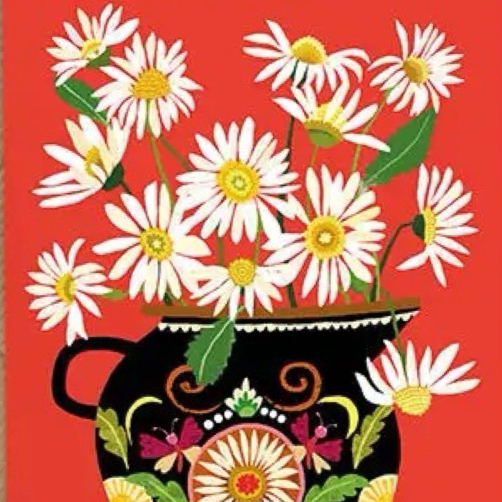 Card featuring a bunch of daisies in a black floral vase, all on a red background.