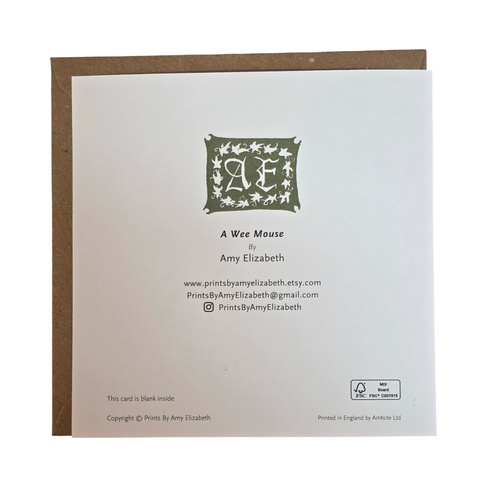 Back of a greeting card with a decorative logo and text.