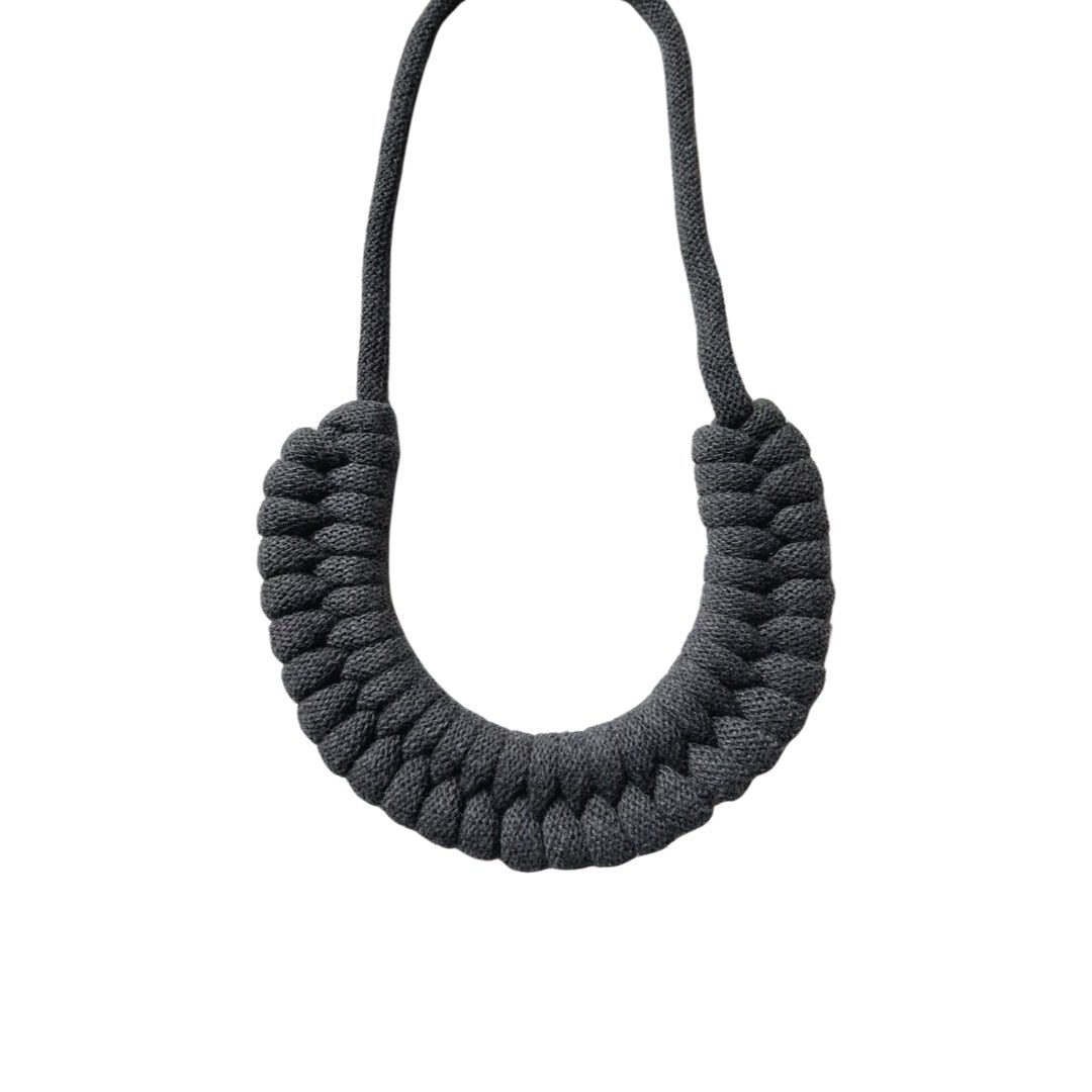 A hand-knotted style necklace made by hand from 100% recycled grey cotton cord with a magnetic metal fastening. 