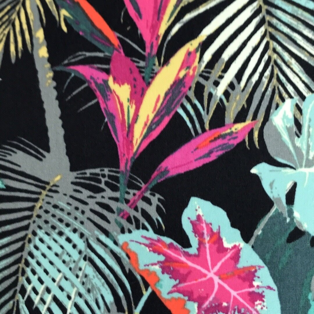 Dark fabric with bright tropical flowers and leaves