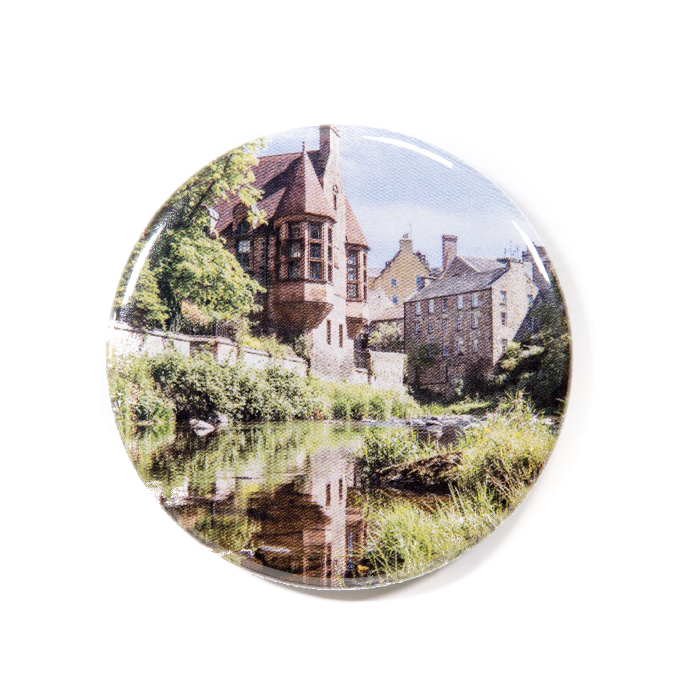 A round magnet with a picture of Dean Village. 