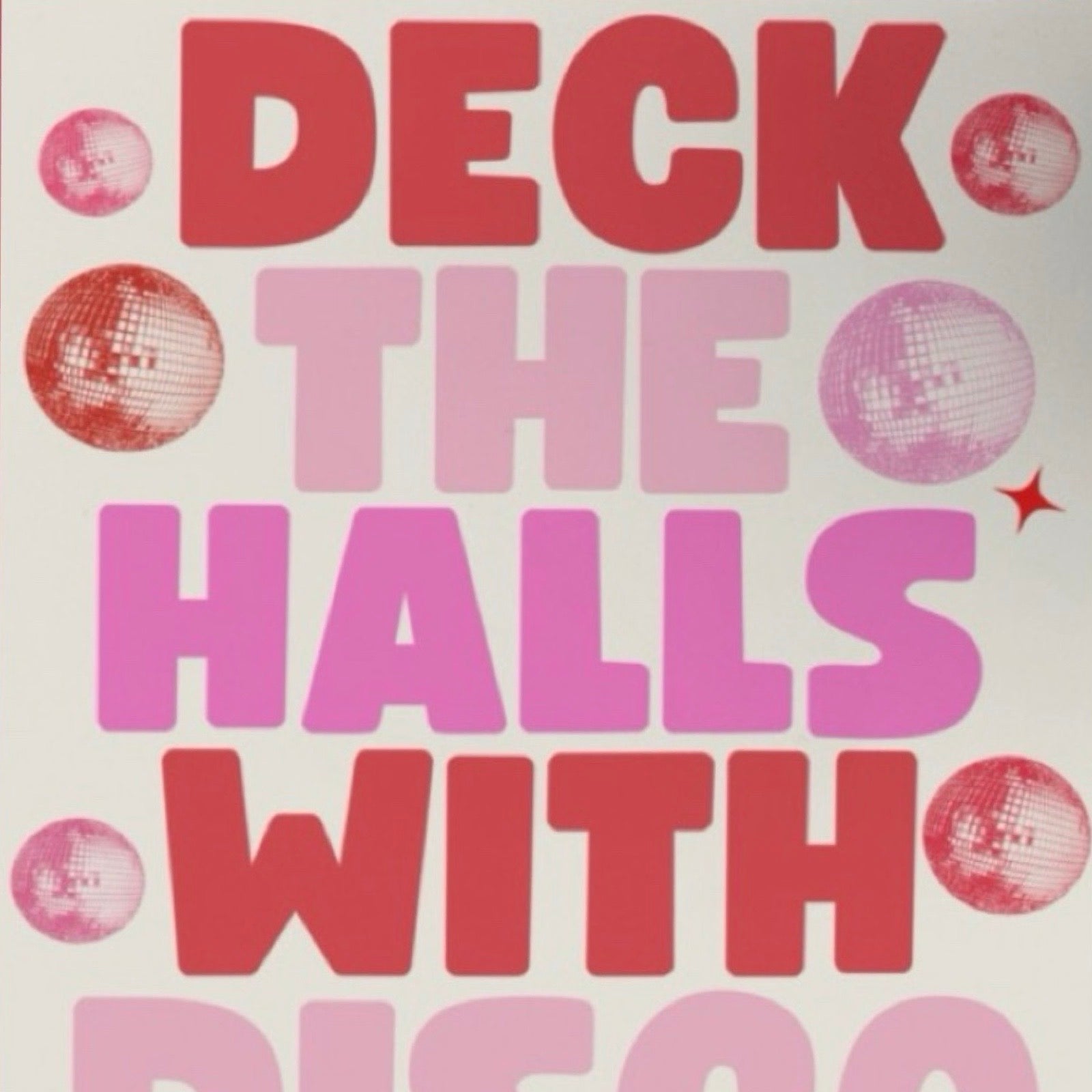 This Christmas card features the text 'Deck the Halls with Disco Balls' in red and pink lettering surrounded by red and pink disco balls all on a white background.
