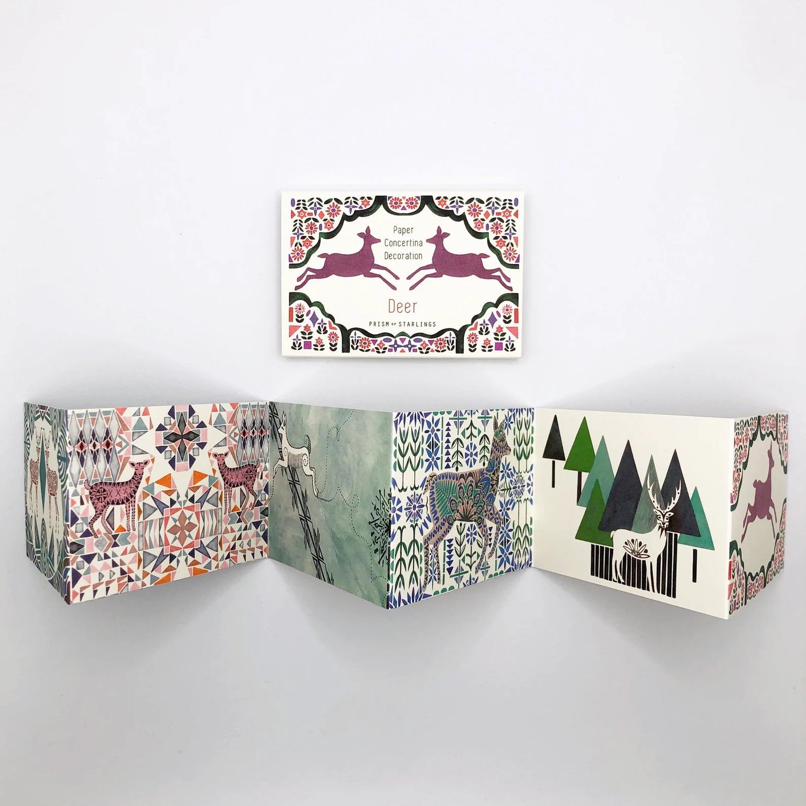 Open book with deer illustrations on a white background.