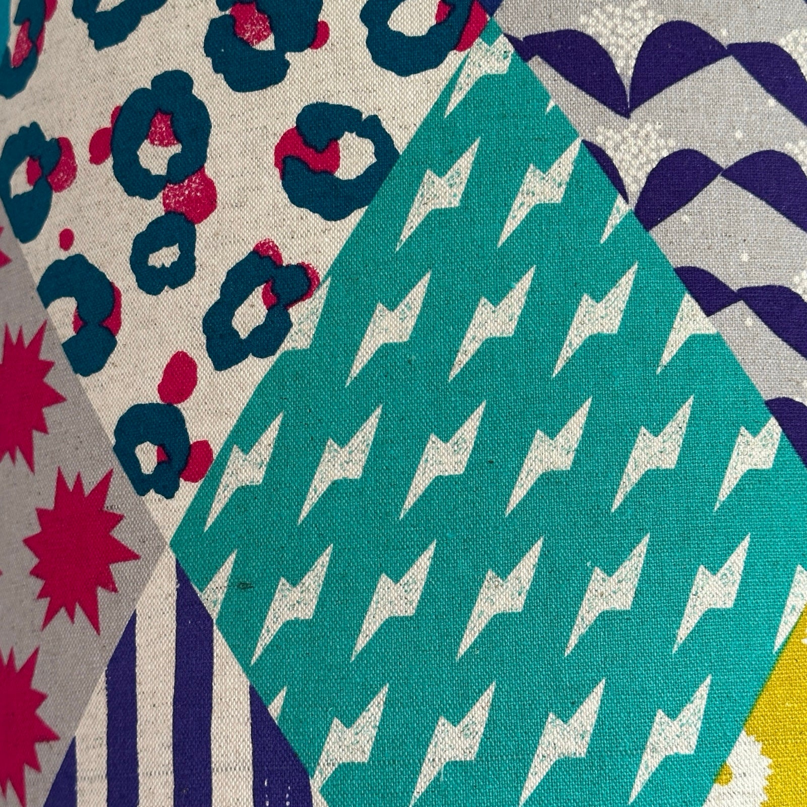 Colourful geometric patterned lampshade.