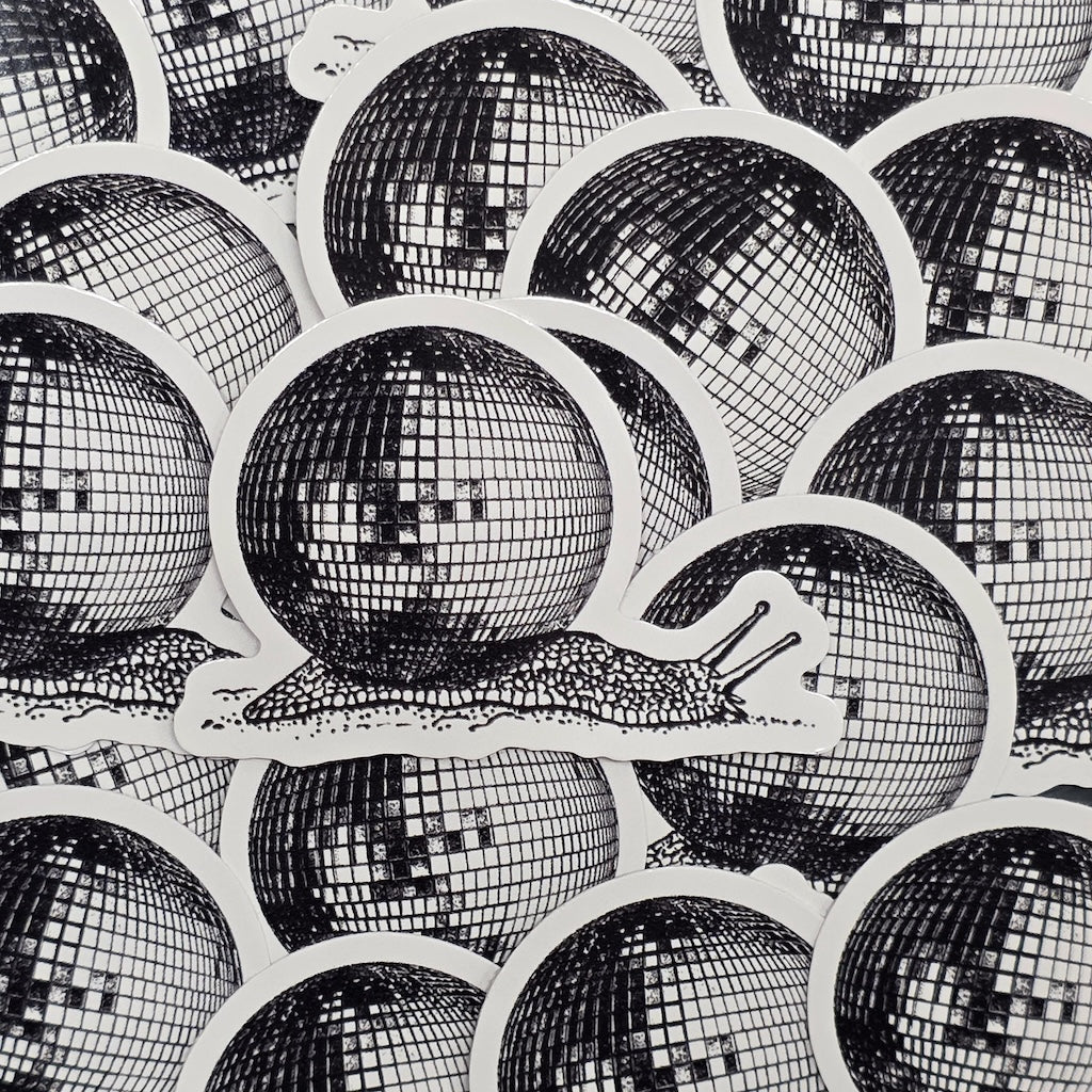 A waterproof vinyl sticker of a snail carrying a giant disco ball on its back.