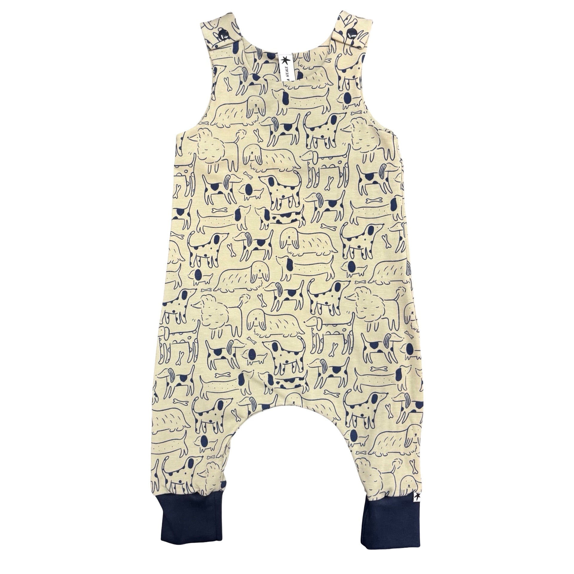 Children's overalls with dog pattern on a white background.