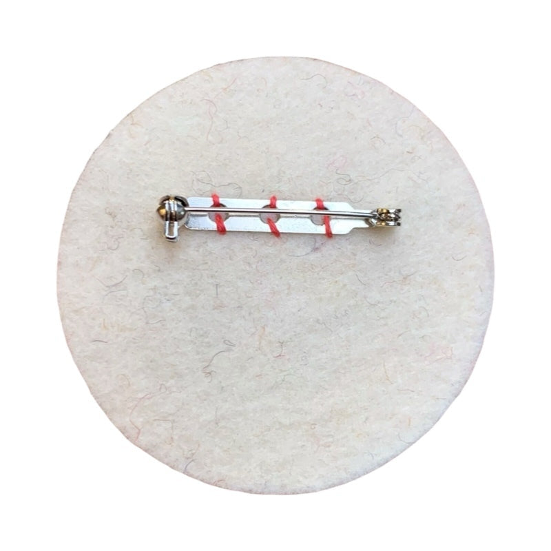 This gorgeous doll face brooch is made from 2 layers of beautiful fat 3mm merino wool felt. 