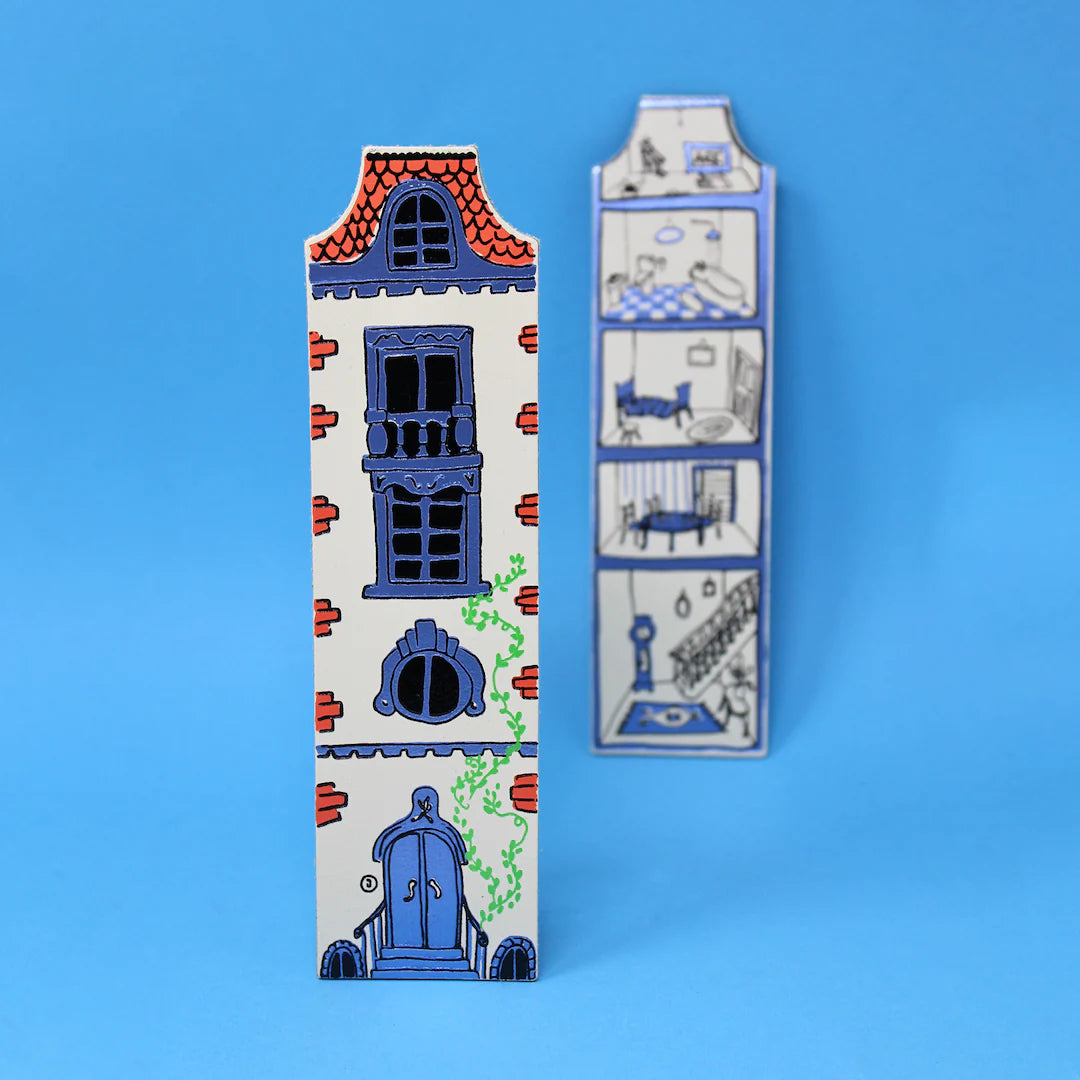 Decorative bookmark with dolls house design on a blue background.