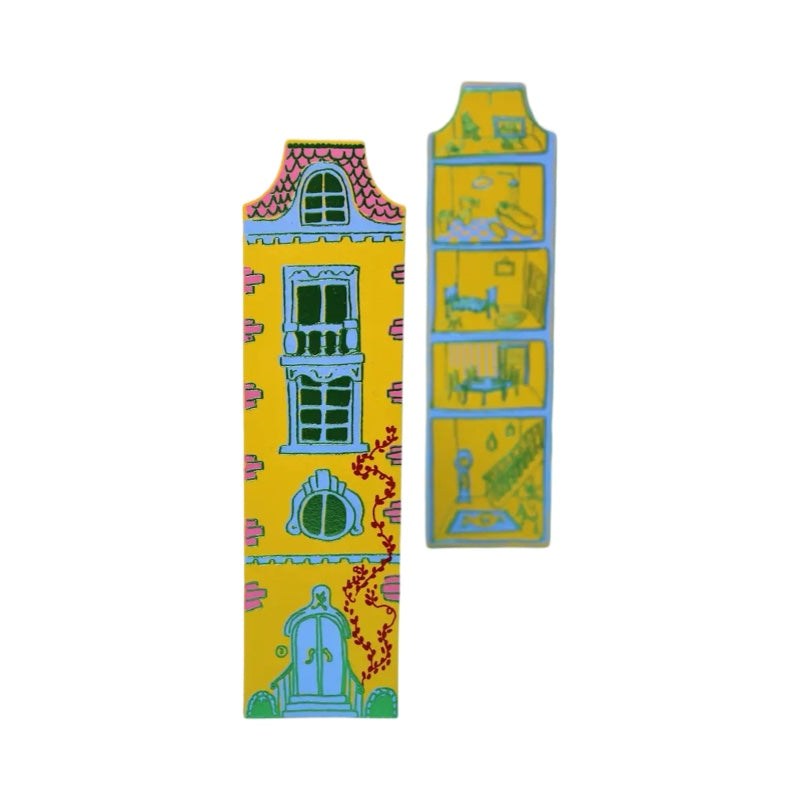 Yellow leather bookmark in the shape of a tall doll house with the outside of the building on one side and rooms of the house on the other.