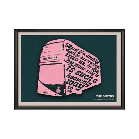Typography print of the lyric 'and if a double decker bus crashes into us, to die by your side is such a heavenly way to die' from the song There Is a Light That Never Goes Out by The Smiths. The lyrics are written on the side of a pink double-decker bus against a green background.