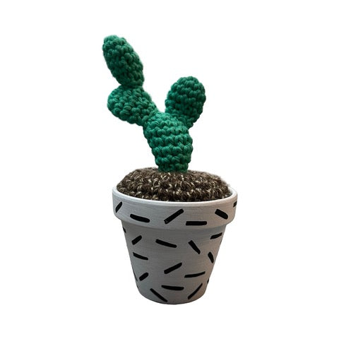 Handmade double stem crochet cactus in a white and black speckle painted terracotta pot. 