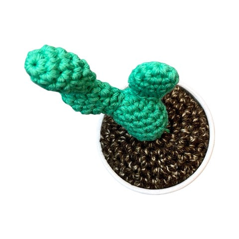 Handmade double stem crochet cactus in a white and black speckle painted terracotta pot. 