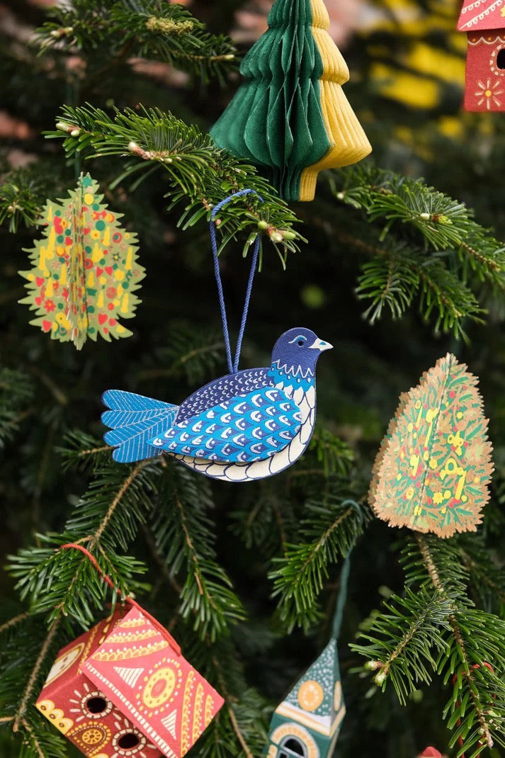 Colourful Christmas ornaments hanging on a tree.