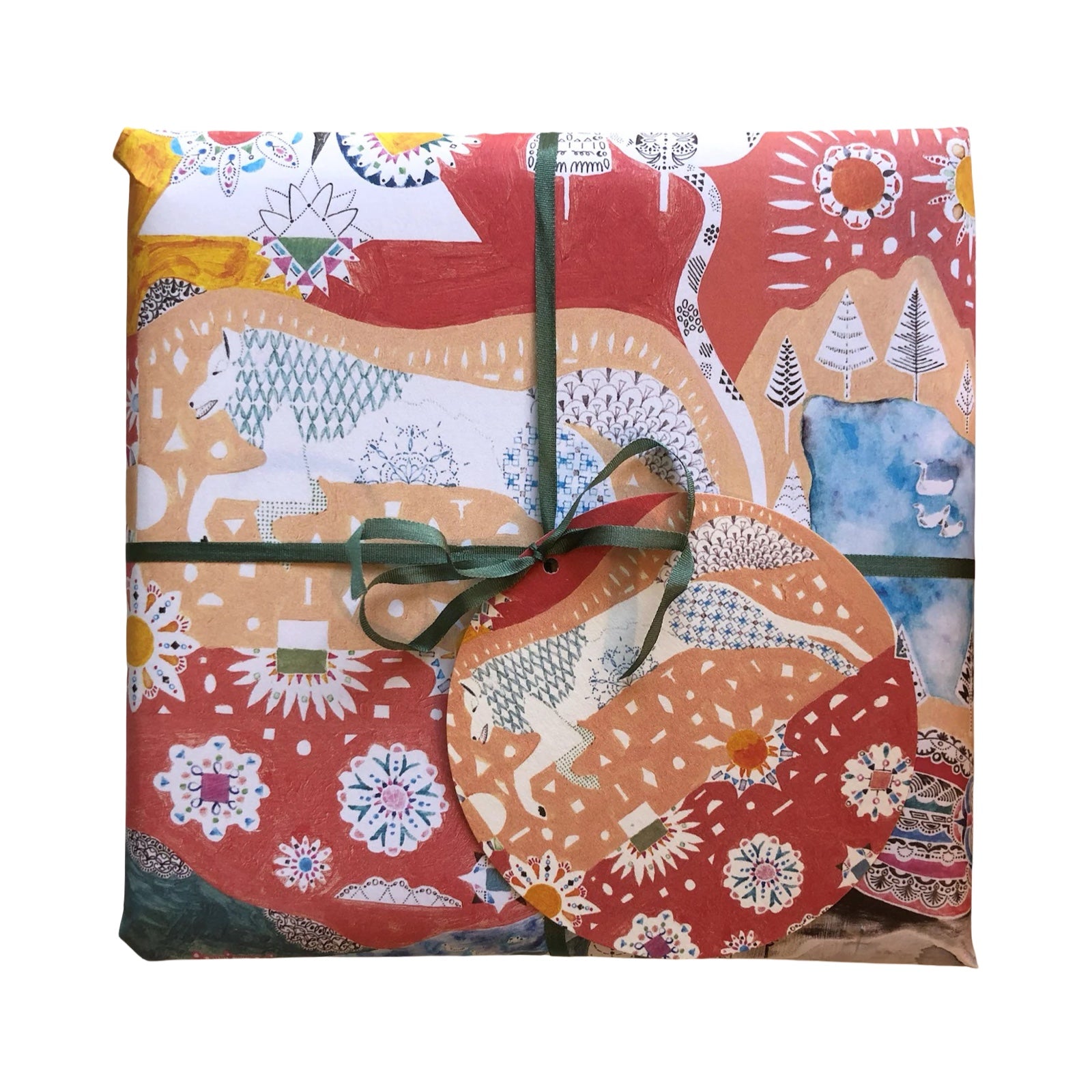 Gift wrapped in colourful patterned paper with a green ribbon on a white background.