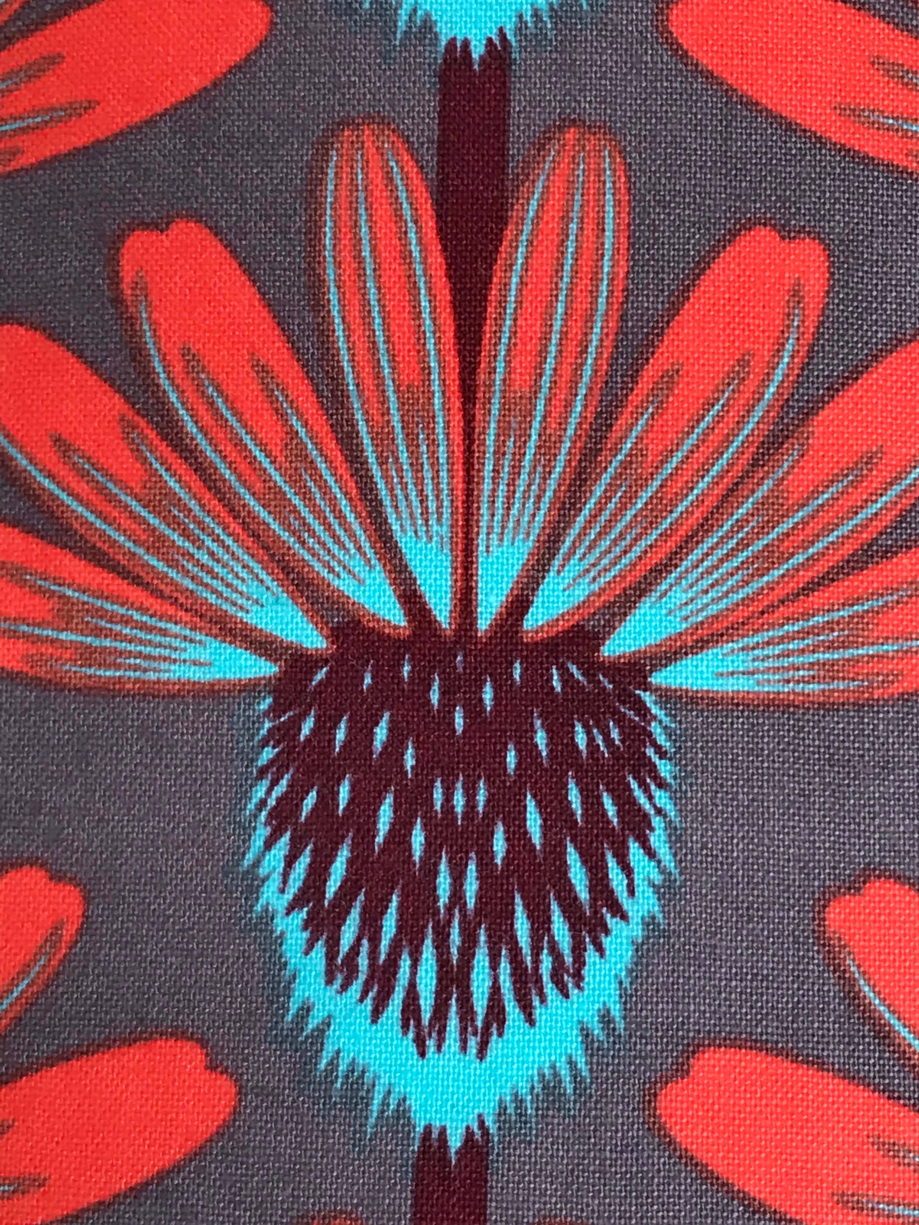 Grey fabric with red, brown and blue echinacea flowers