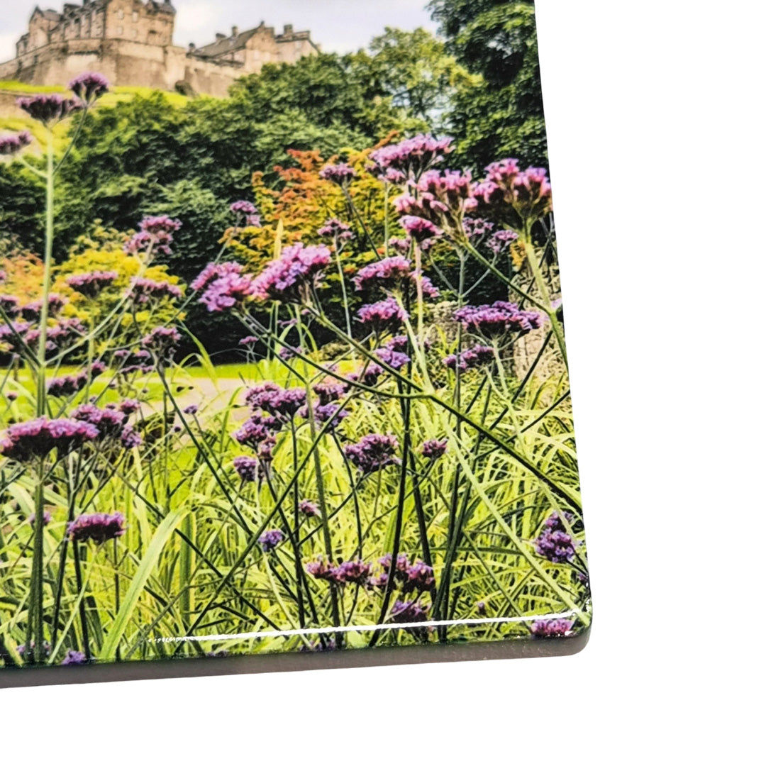 A close up of a ceramic coaster showing a picture of Edinburgh Castle. 
