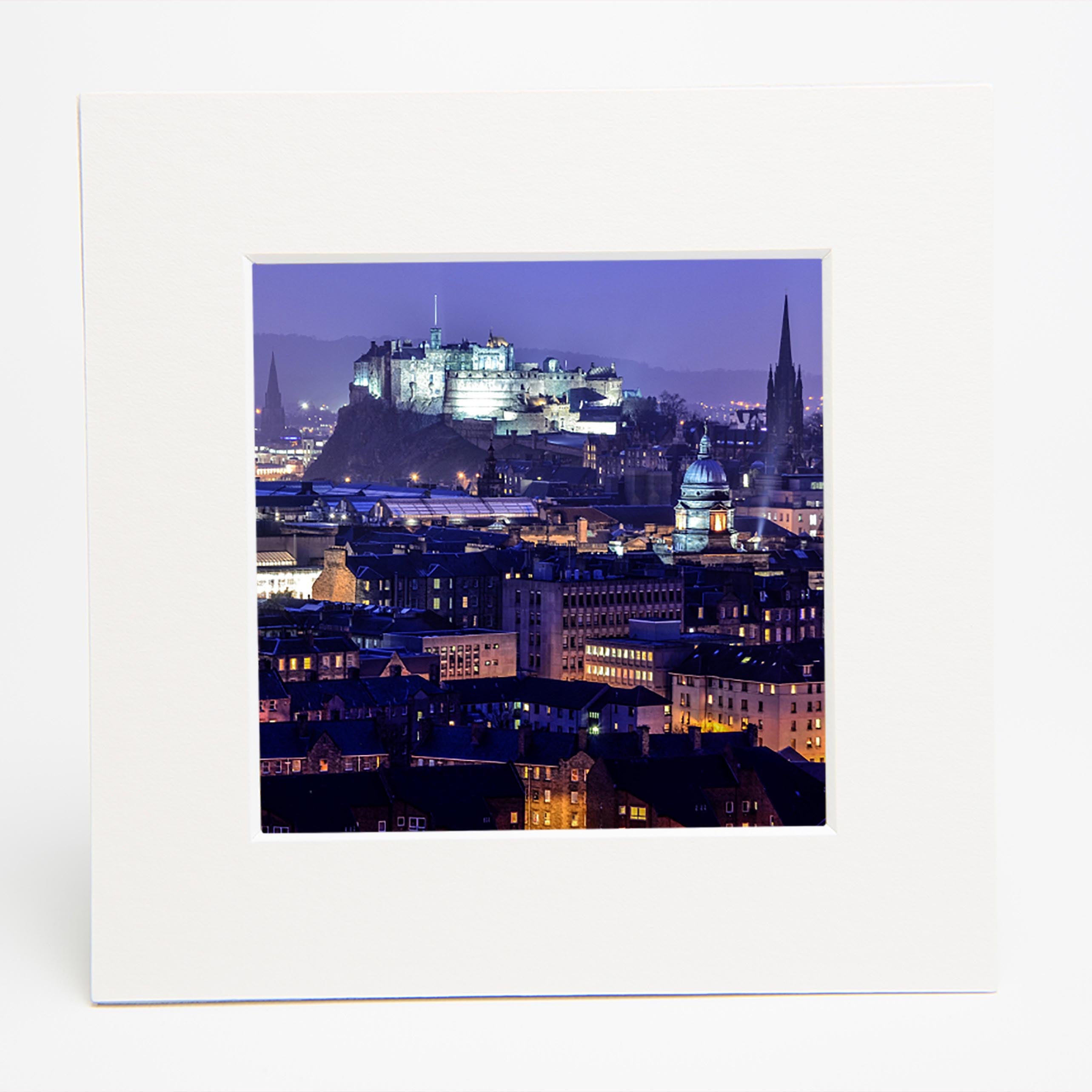 An image of Edinburgh Castle at night in a square mount. 