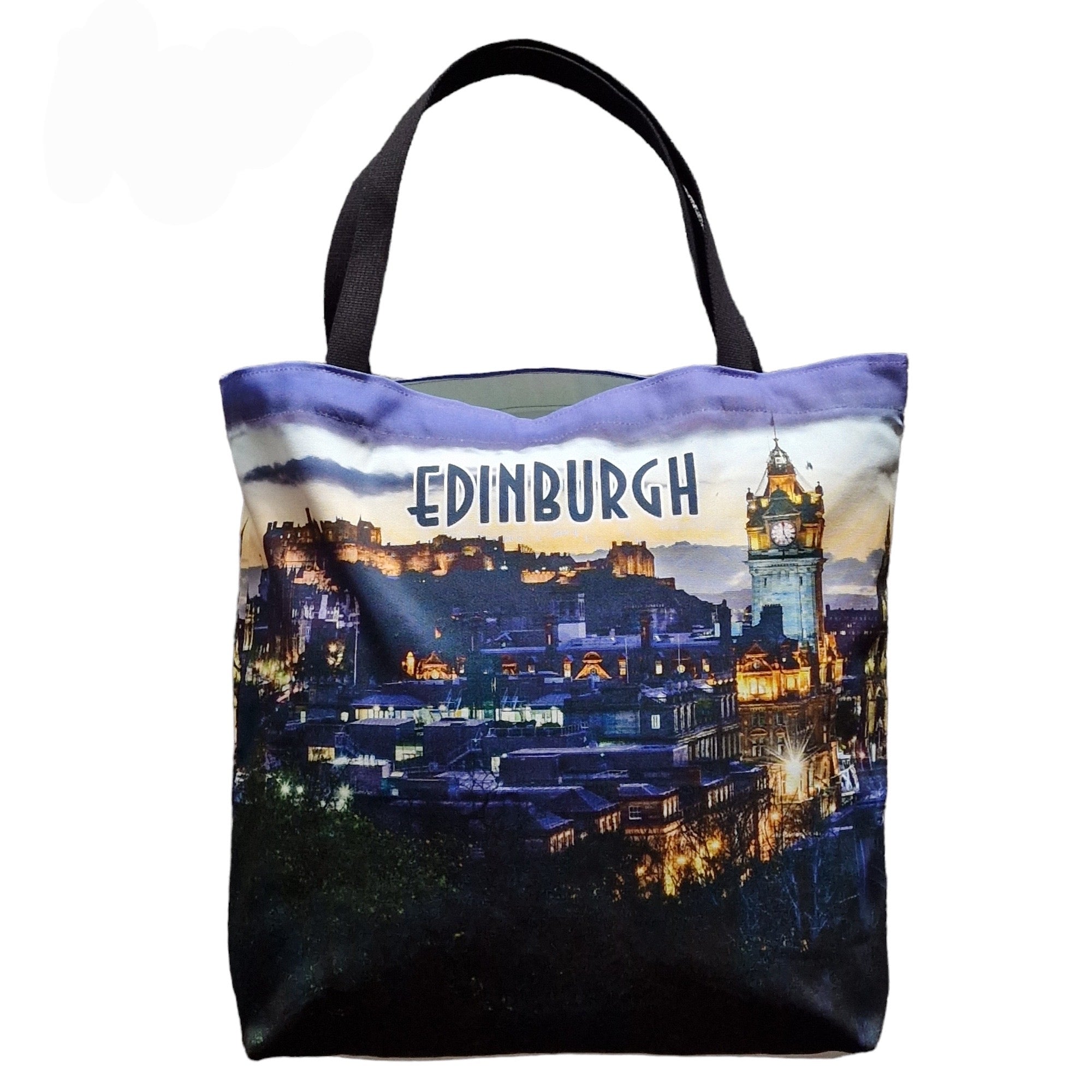 A tote bag with a printed image of the Edinburgh skyline, including Edinburgh Castle, on a white background with black straps.